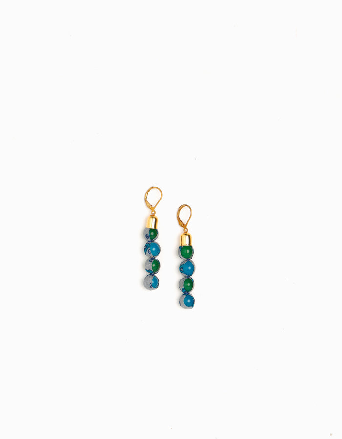 Experience the allure of Beaded Dangler Earrings, a fusion of recycled glass beads and pre-loved sari fabric. Skin-friendly with hypoallergenic hooks, these earrings bring a touch of sustainability to your accessory collection.