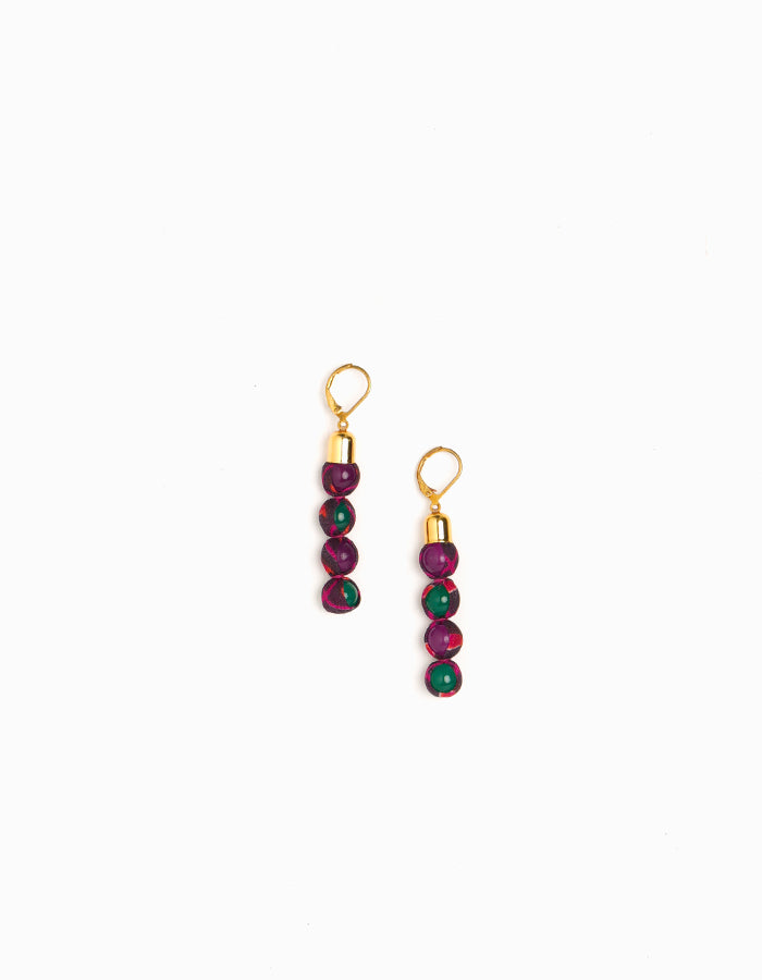 Experience the allure of Beaded Dangler Earrings, a fusion of recycled glass beads and pre-loved sari fabric. Skin-friendly with hypoallergenic hooks, these earrings bring a touch of sustainability to your accessory collection.