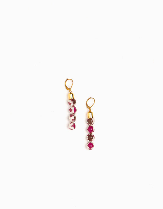 Experience the allure of Beaded Dangler Earrings, a fusion of recycled glass beads and pre-loved sari fabric. Skin-friendly with hypoallergenic hooks, these earrings bring a touch of sustainability to your accessory collection.
