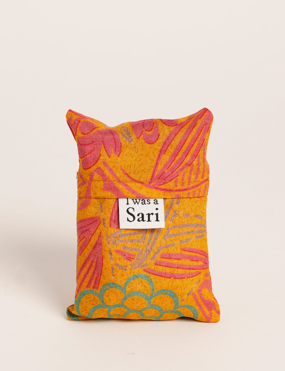 Stay eco-conscious with our Reusable Bag, handmade by Indian artisans from pre-loved saris. Silky and lightweight, this foldaway bag is perfect for your on-the-go lifestyle. Each piece is a unique statement of ethical fashion, embracing sustainability and style.