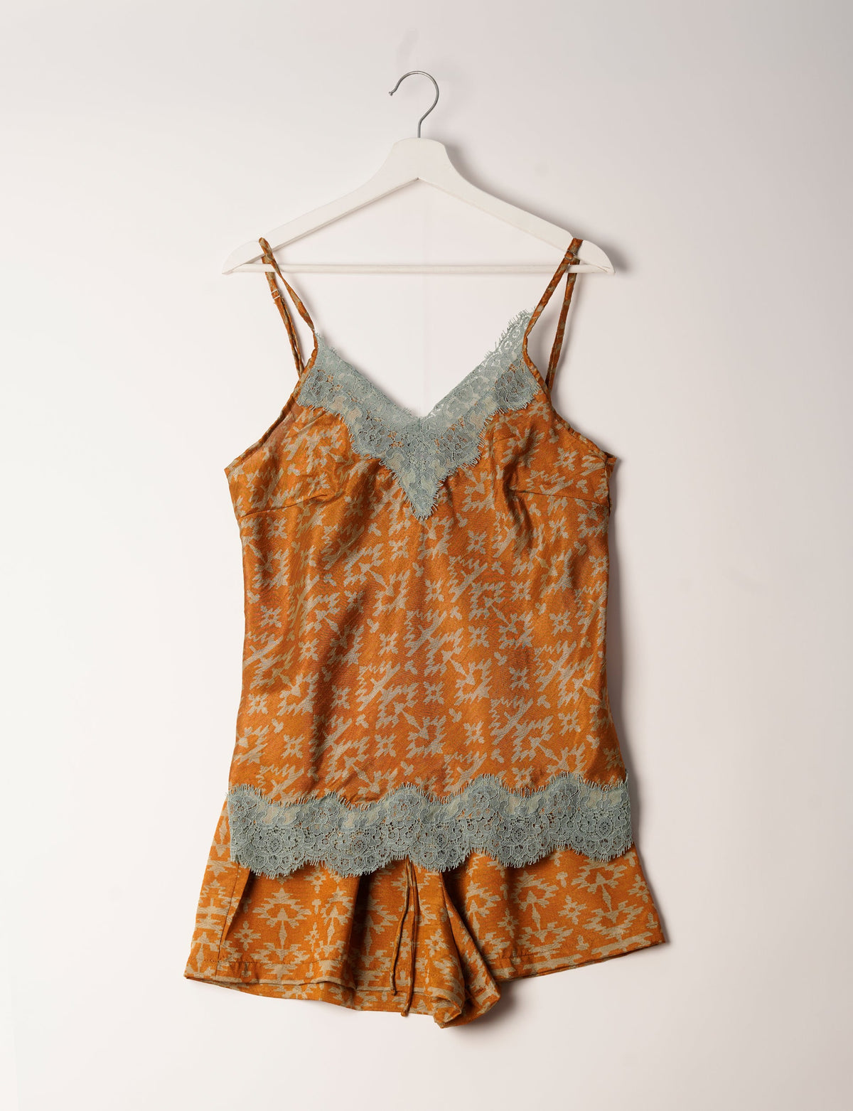 Sleep in eco-friendly luxury with our PJ Set Short. Made for the conscious consumer, these pajamas contribute to zero waste and sustainable practices. The cami top, adorned with delicate eyelash lace and cut on the bias, pairs seamlessly with the comfy shorts featuring an elasticated waist and drawstring tie.