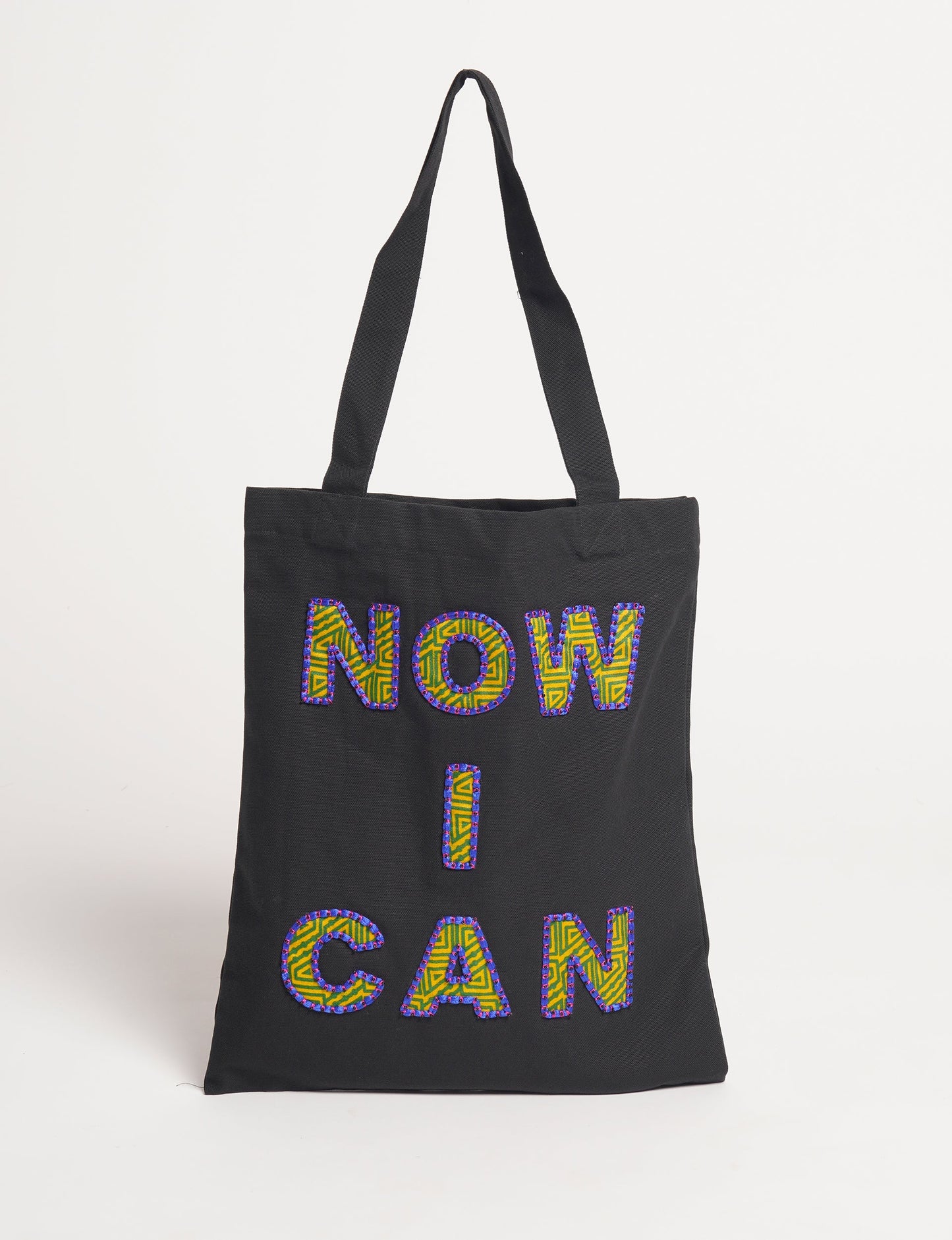 Discover empowerment with our NOW I CAN TOTE BAG – a distinctive piece from our embroidery collection, commemorating positive transformations in the lives of our women artisans. Each bag signifies empowerment, from community pride to supporting education dreams. Carefully crafted with embroidered signatures, these bags are not only visually appealing but also embody the artisans' journeys and the reincarnation of pre-loved saris into a new form – as your treasured bag.