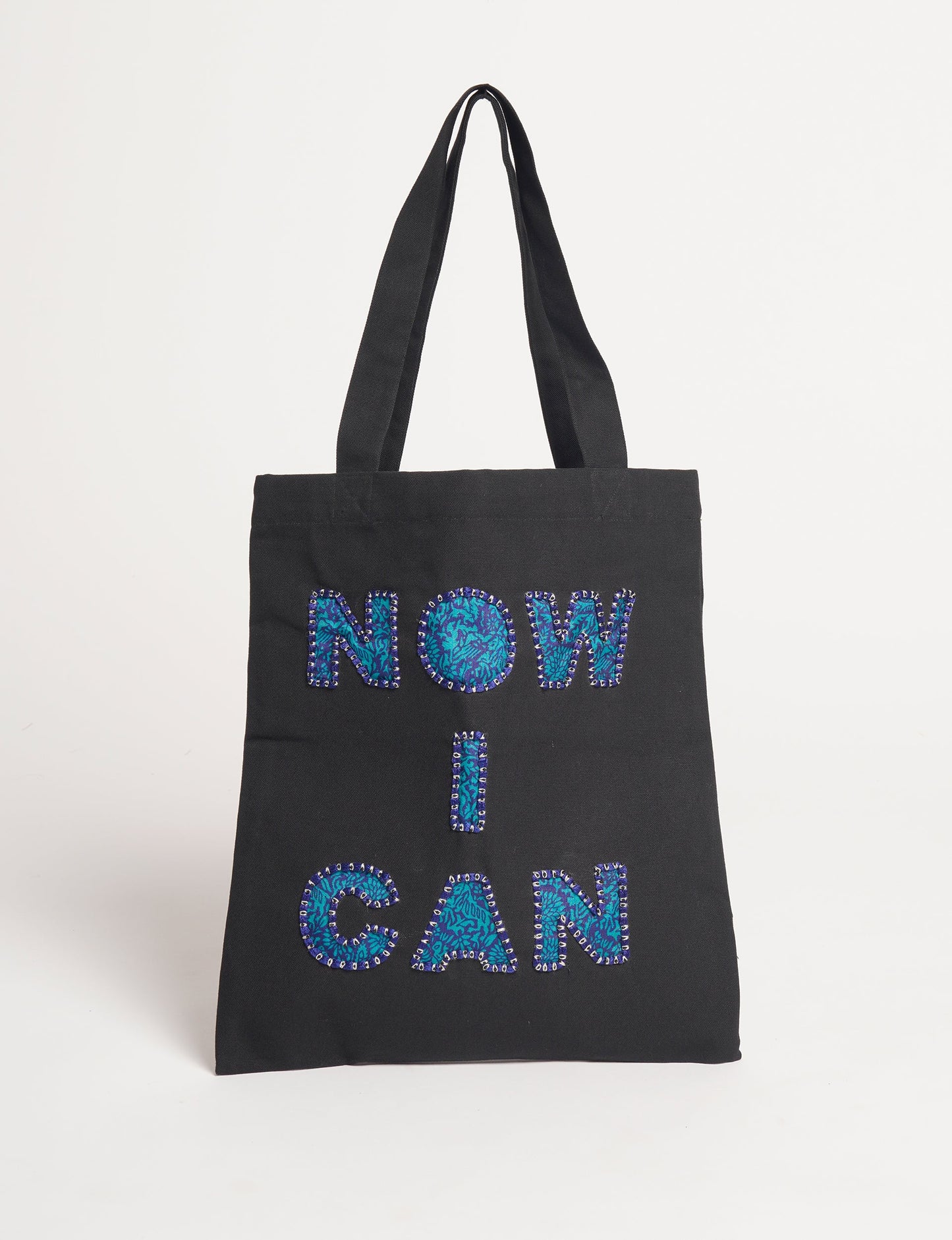 Discover empowerment with our NOW I CAN TOTE BAG – a distinctive piece from our embroidery collection, commemorating positive transformations in the lives of our women artisans. Each bag signifies empowerment, from community pride to supporting education dreams. Carefully crafted with embroidered signatures, these bags are not only visually appealing but also embody the artisans' journeys and the reincarnation of pre-loved saris into a new form – as your treasured bag.