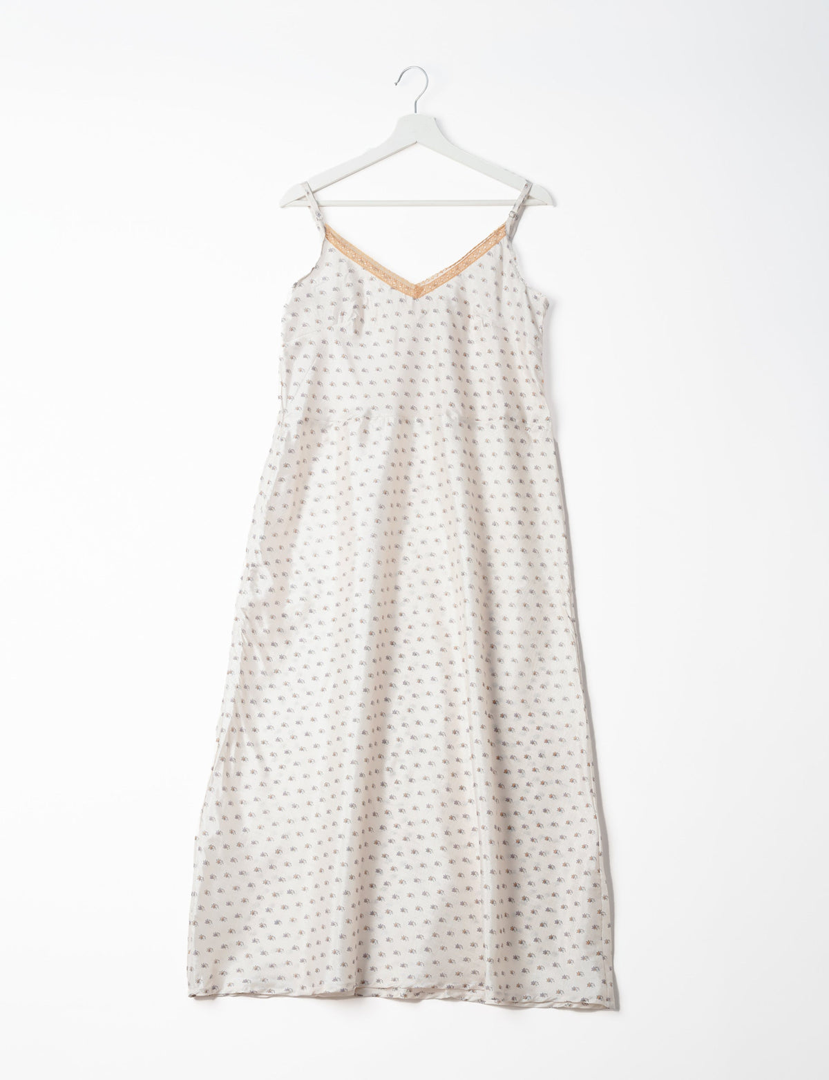 Spaghetti strap dress made from sustainable materials, embodying ethical fashion principles. Ideal for eco-friendly travelers seeking laid-back style.