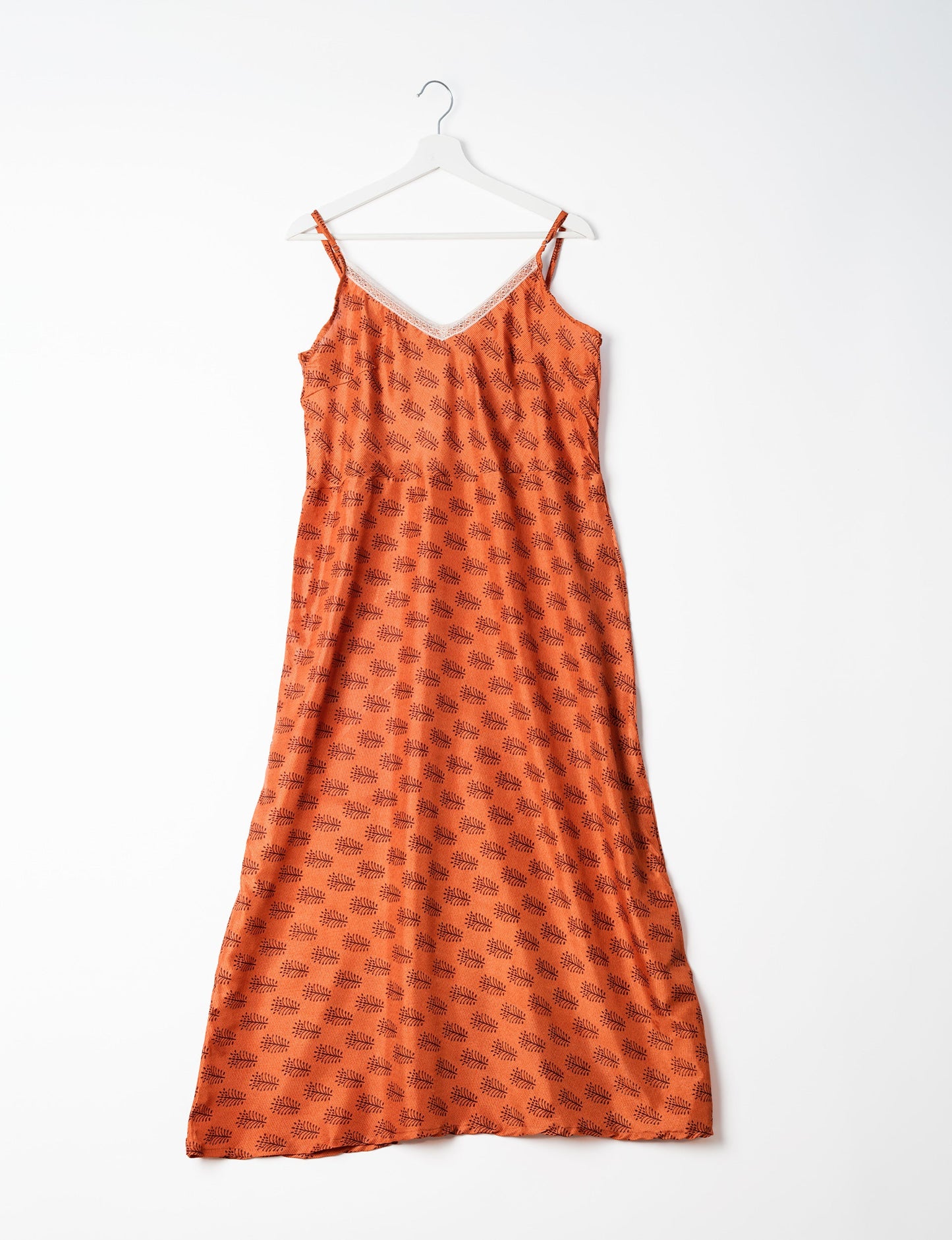 Spaghetti strap dress made from sustainable materials, embodying ethical fashion principles. Ideal for eco-friendly travelers seeking laid-back style.