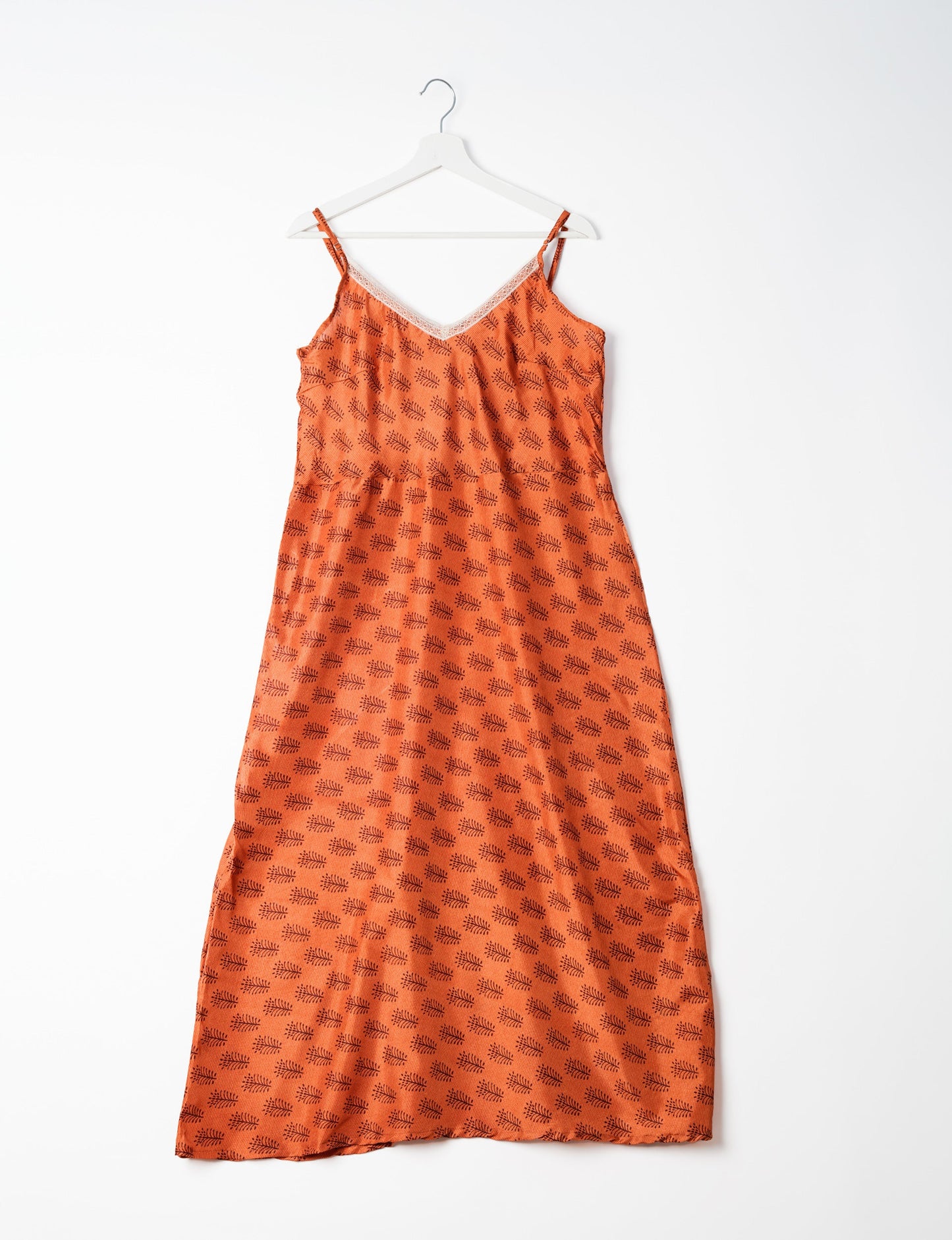 Spaghetti strap dress made from sustainable materials, embodying ethical fashion principles. Ideal for eco-friendly travelers seeking laid-back style.