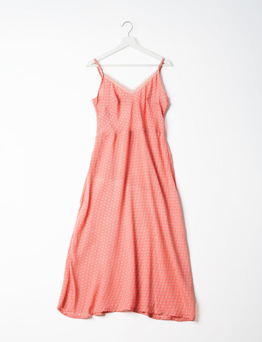 Spaghetti strap dress made from sustainable materials, embodying ethical fashion principles. Ideal for eco-friendly travelers seeking laid-back style.