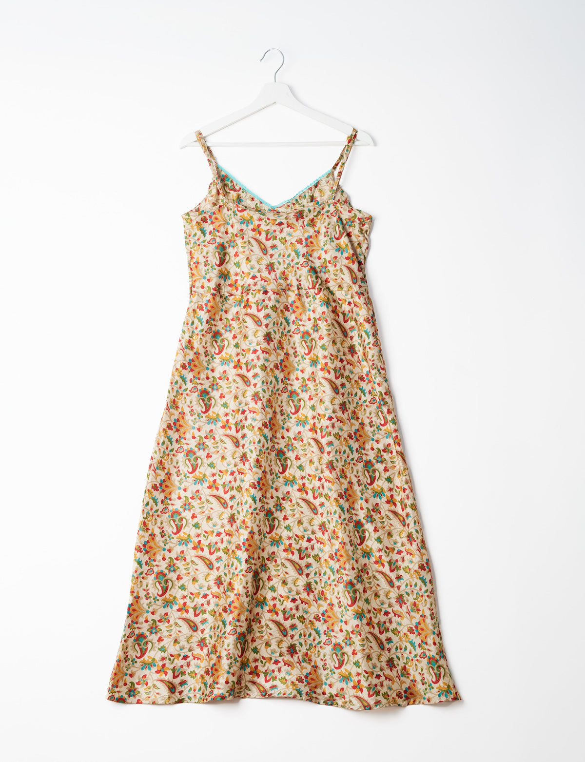 Spaghetti strap dress made from sustainable materials, embodying ethical fashion principles. Ideal for eco-friendly travelers seeking laid-back style.
