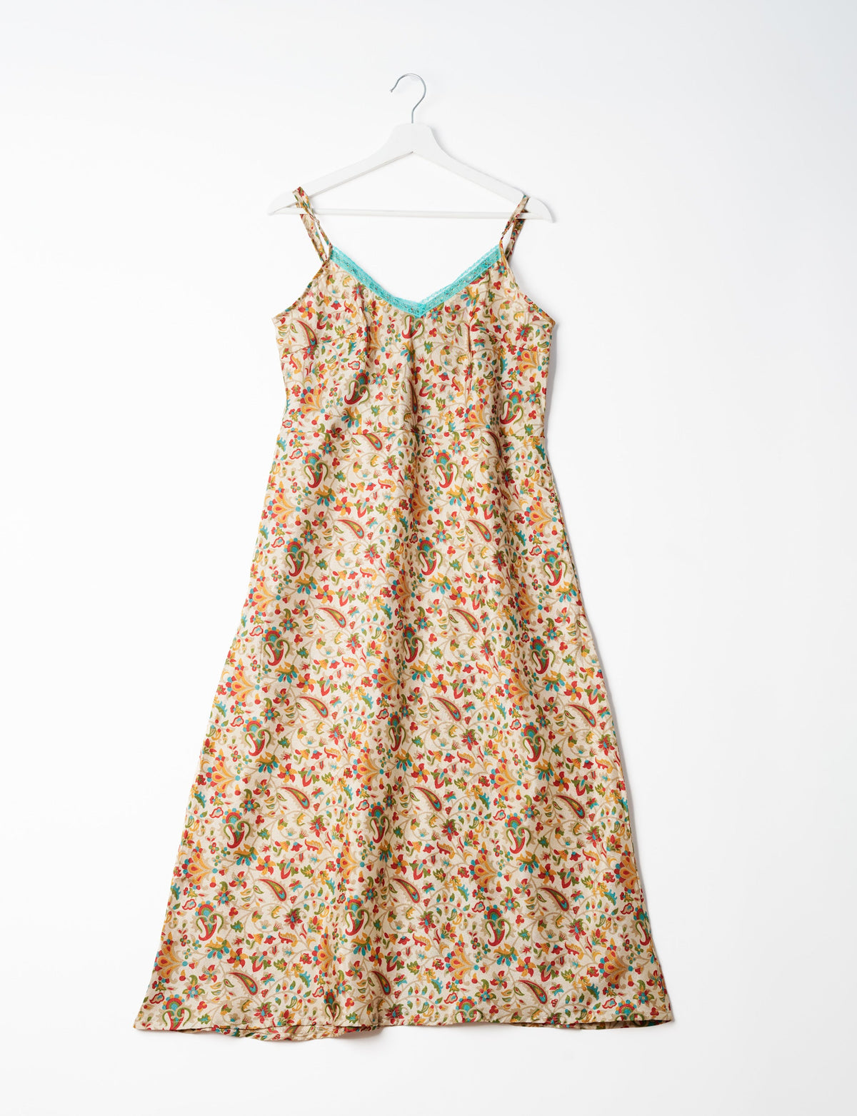 Spaghetti strap dress made from sustainable materials, embodying ethical fashion principles. Ideal for eco-friendly travelers seeking laid-back style.