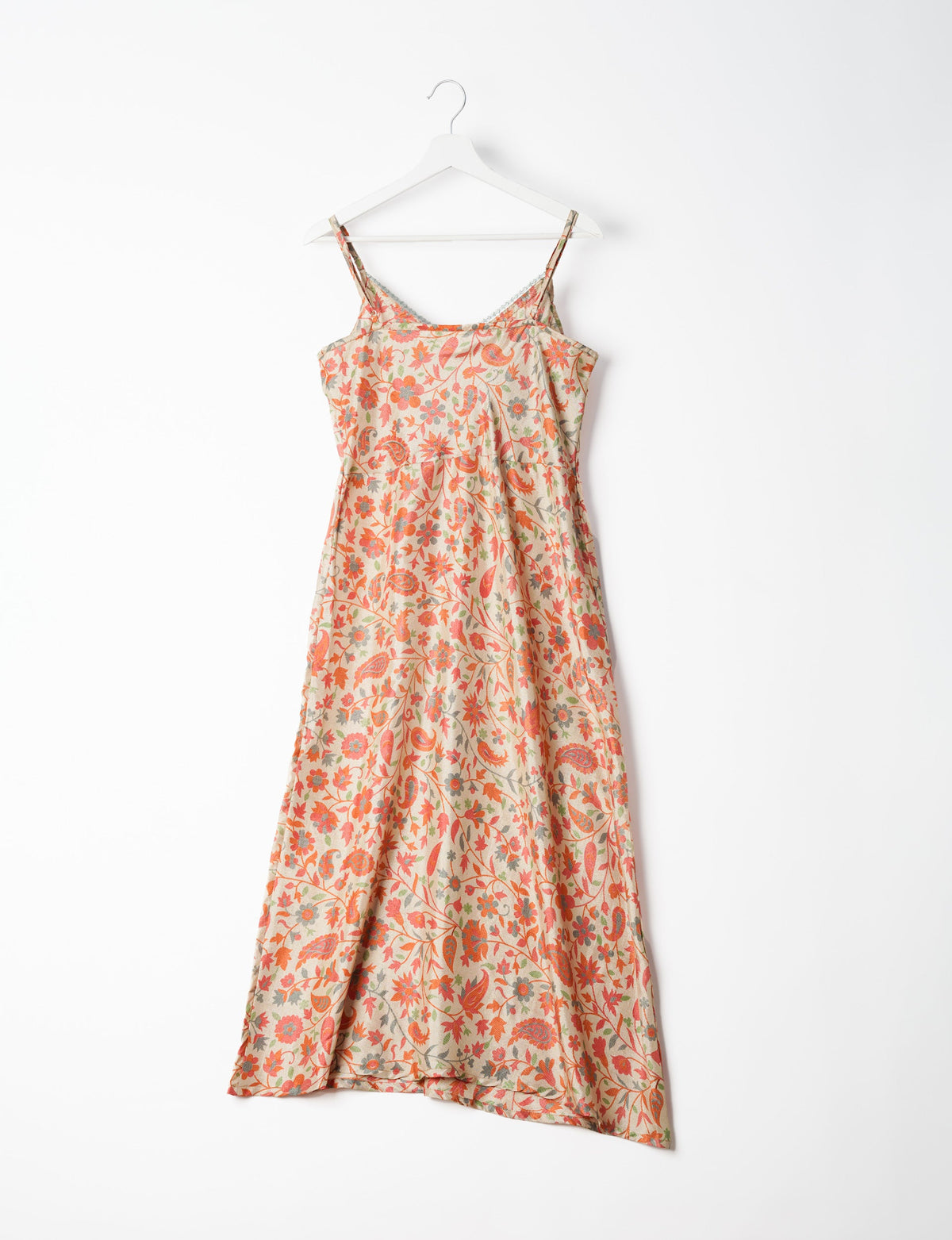 Spaghetti strap dress made from sustainable materials, embodying ethical fashion principles. Ideal for eco-friendly travelers seeking laid-back style.