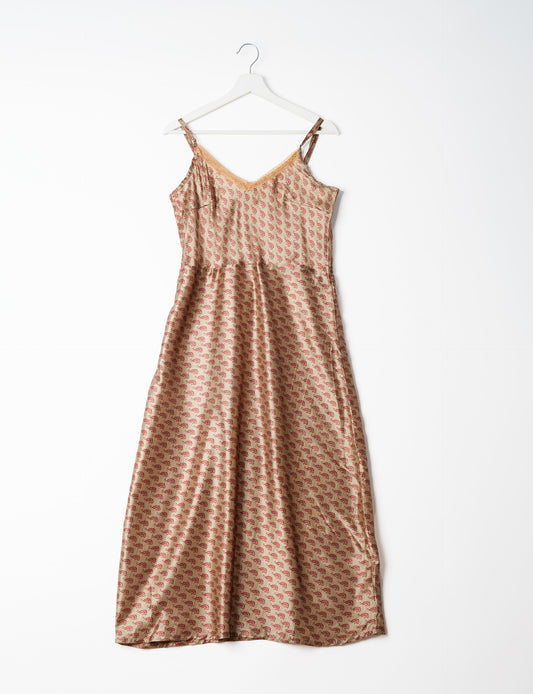 Spaghetti strap dress made from sustainable materials, embodying ethical fashion principles. Ideal for eco-friendly travelers seeking laid-back style.