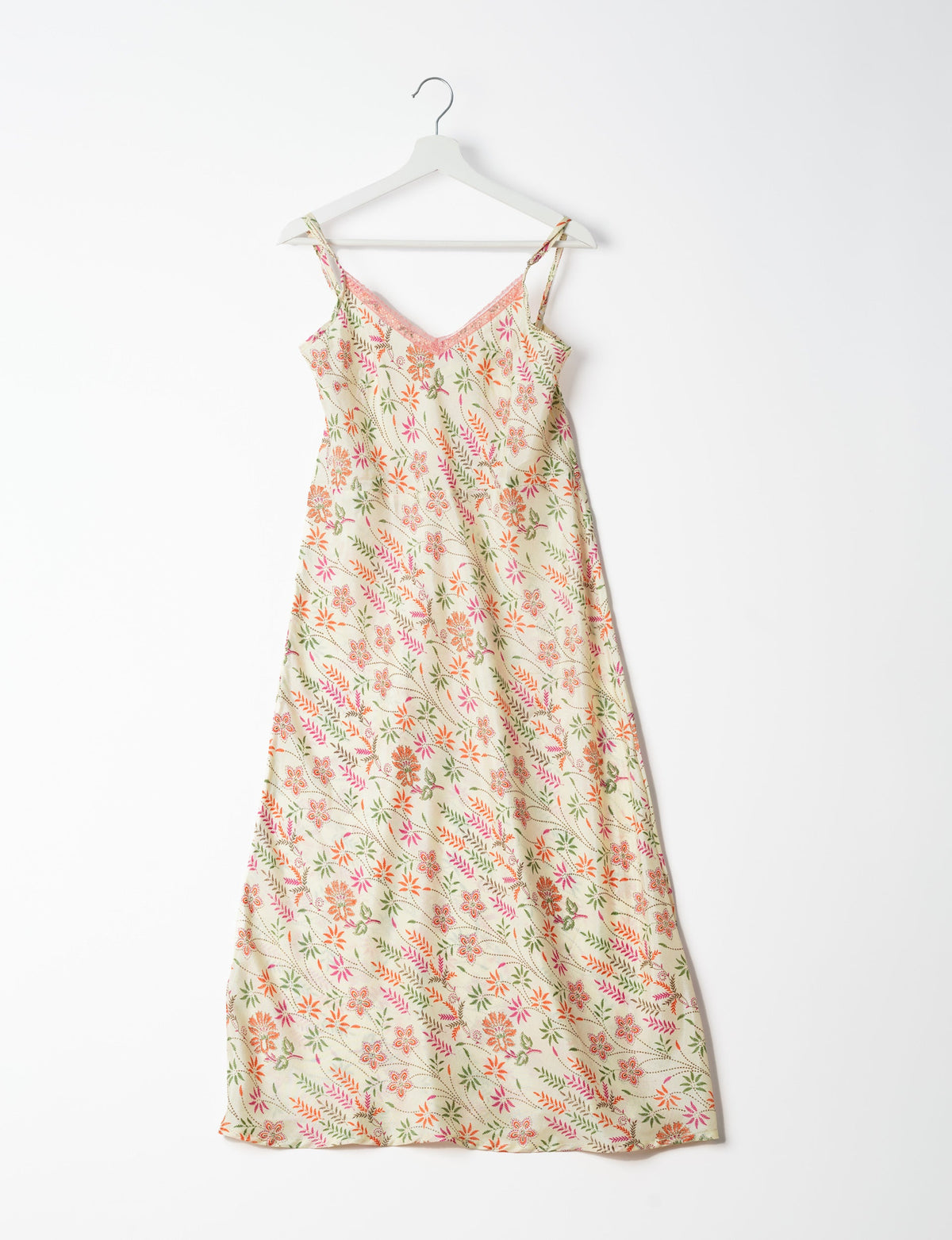 Spaghetti strap dress made from sustainable materials, embodying ethical fashion principles. Ideal for eco-friendly travelers seeking laid-back style.