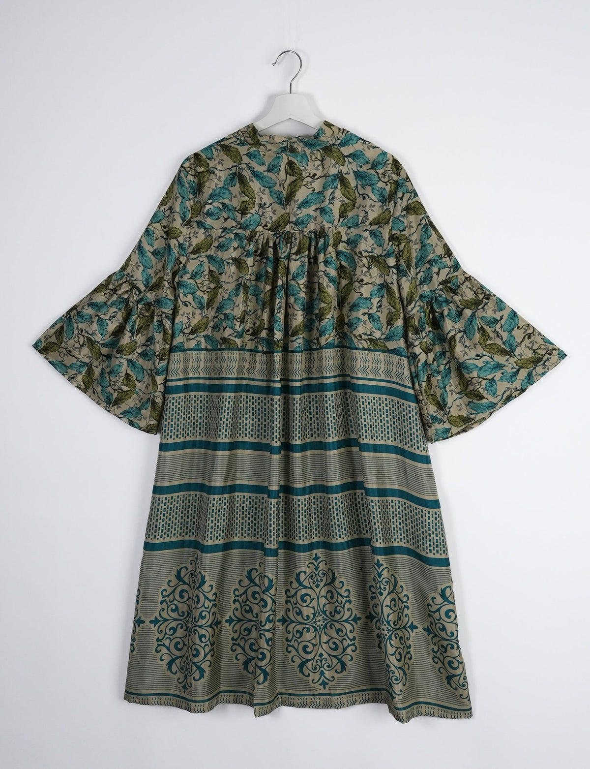 Discover ethical elegance with our Bell Sleeve Coat, handcrafted by Indian artisans from recycled materials. This sustainable fashion piece is a statement in eco-friendly clothing, combining style and consciousness effortlessly.