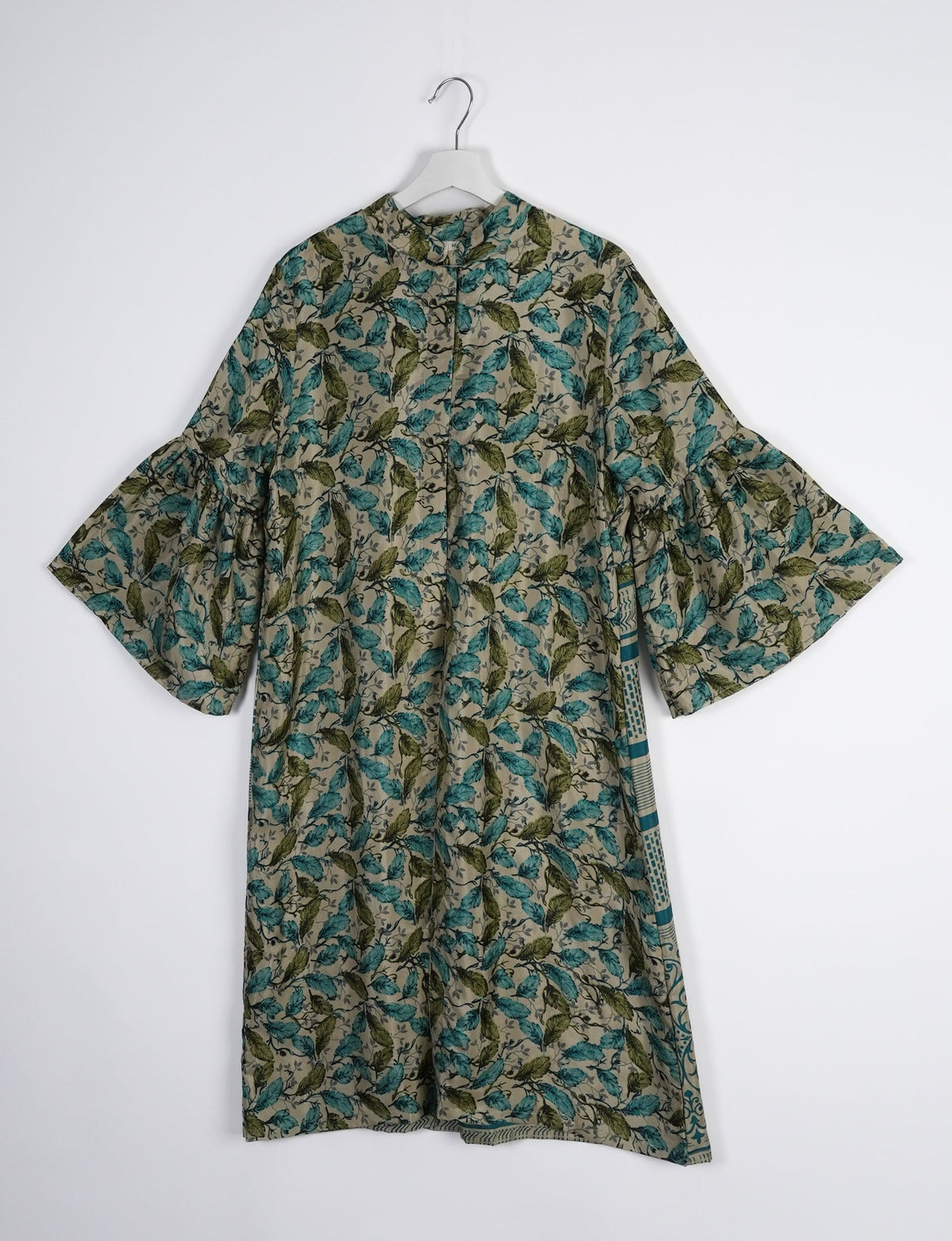 Discover ethical elegance with our Bell Sleeve Coat, handcrafted by Indian artisans from recycled materials. This sustainable fashion piece is a statement in eco-friendly clothing, combining style and consciousness effortlessly.