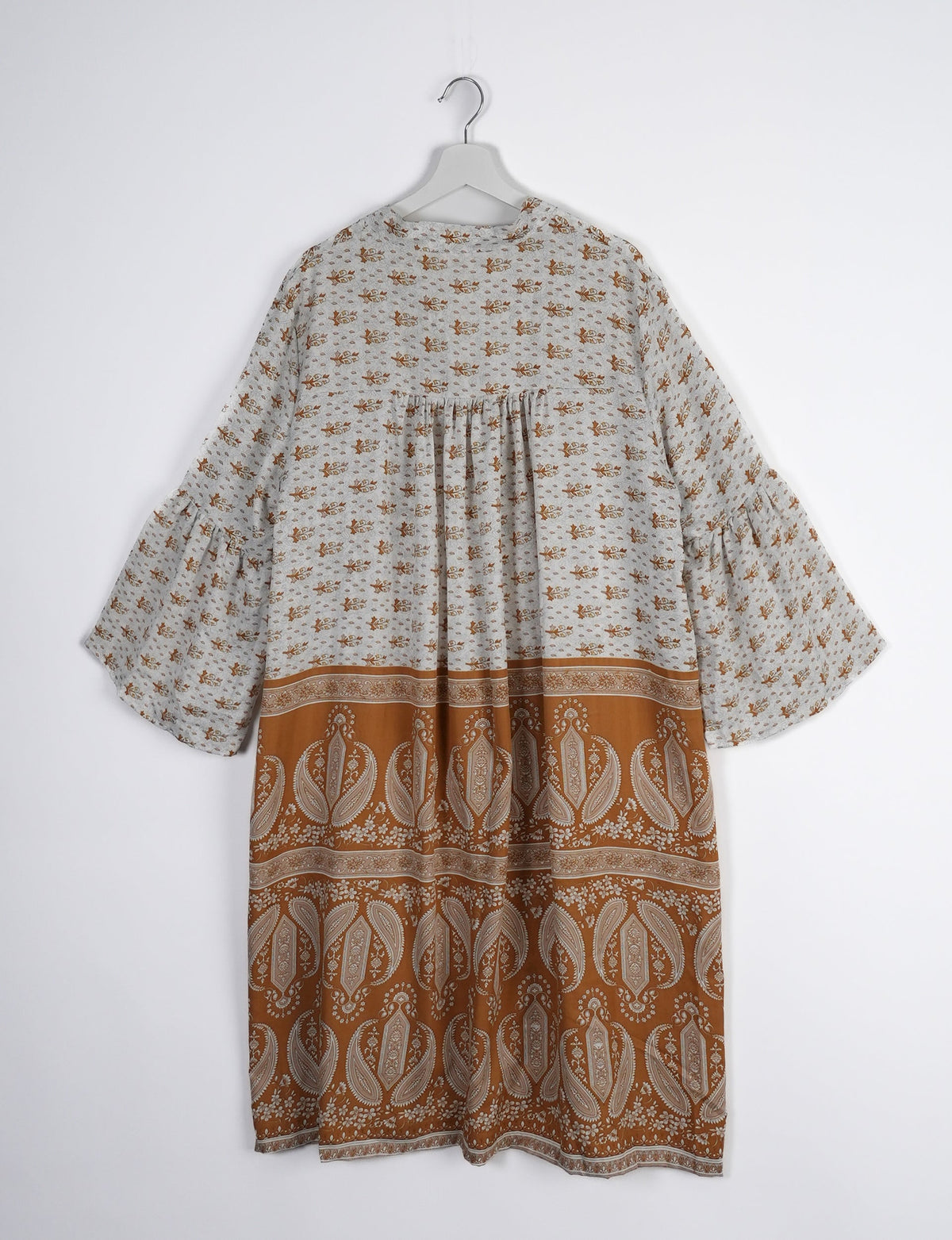 Discover ethical elegance with our Bell Sleeve Coat, handcrafted by Indian artisans from recycled materials. This sustainable fashion piece is a statement in eco-friendly clothing, combining style and consciousness effortlessly.