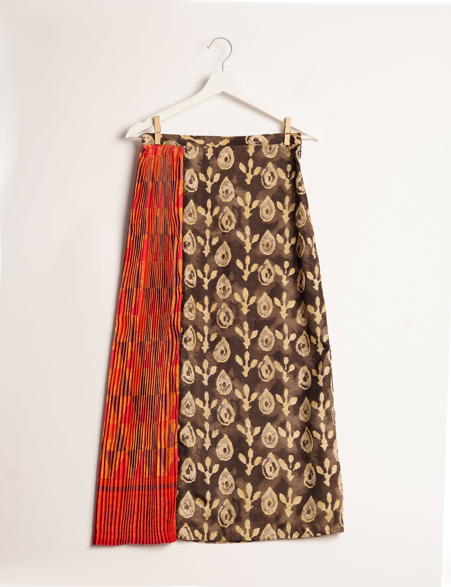 Elevate your wardrobe with the Semi Pleated A-Line Skirt, a sustainable fashion statement. Unique prints, a mix of fabrics, and intricate knife pleats create an individualized, upscale day-to-night look. Crafted with ethical and green fashion values, this skirt represents the essence of eco-friendly style.