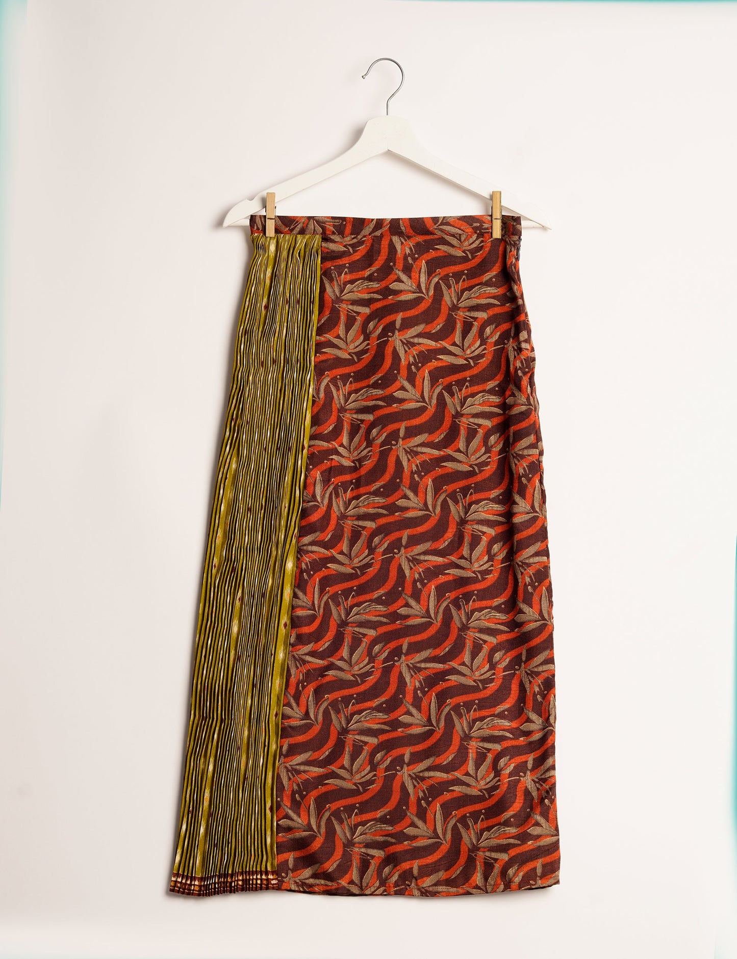 Elevate your wardrobe with the Semi Pleated A-Line Skirt, a sustainable fashion statement. Unique prints, a mix of fabrics, and intricate knife pleats create an individualized, upscale day-to-night look. Crafted with ethical and green fashion values, this skirt represents the essence of eco-friendly style.