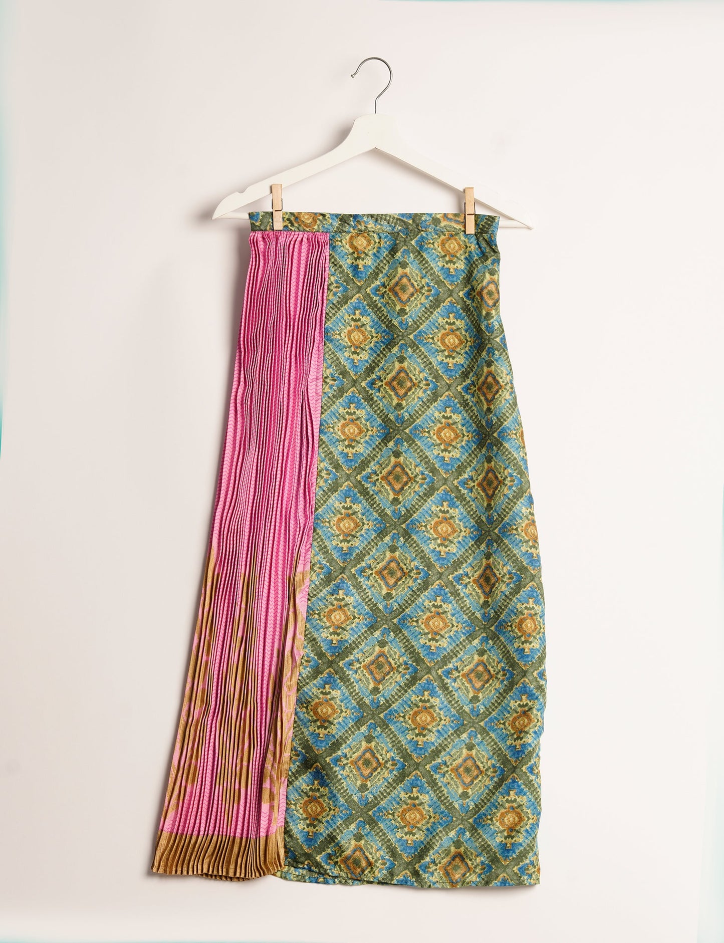 Elevate your wardrobe with the Semi Pleated A-Line Skirt, a sustainable fashion statement. Unique prints, a mix of fabrics, and intricate knife pleats create an individualized, upscale day-to-night look. Crafted with ethical and green fashion values, this skirt represents the essence of eco-friendly style.