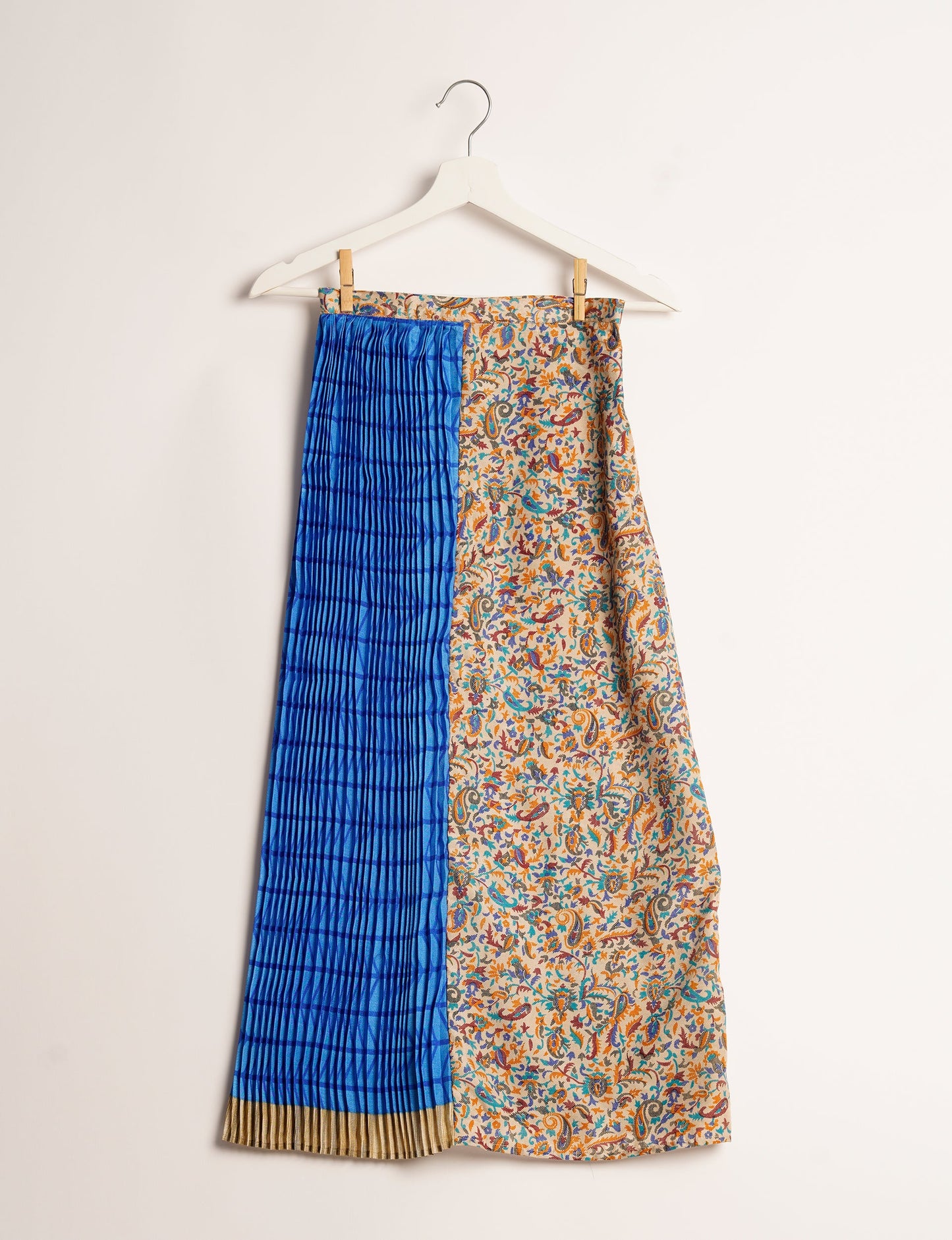 Elevate your wardrobe with the Semi Pleated A-Line Skirt, a sustainable fashion statement. Unique prints, a mix of fabrics, and intricate knife pleats create an individualized, upscale day-to-night look. Crafted with ethical and green fashion values, this skirt represents the essence of eco-friendly style.