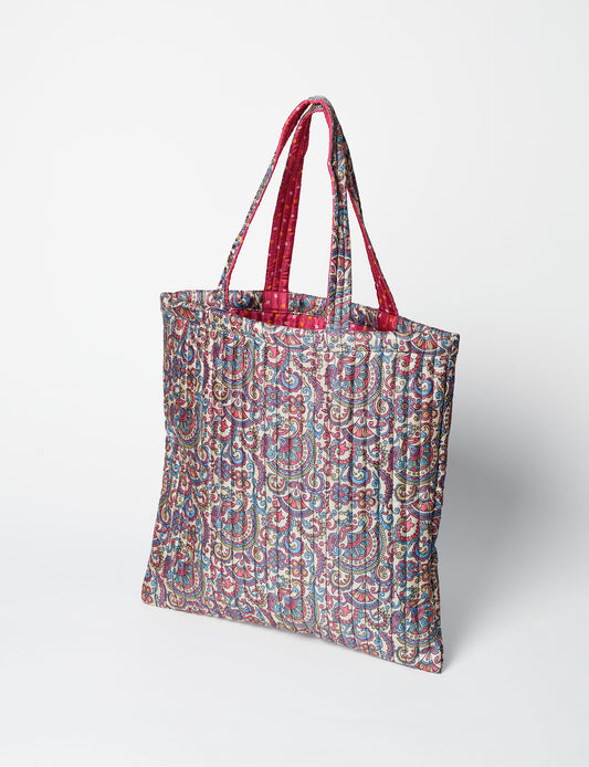 Elevate your style sustainably with our QUILTED SHOPPER BAG. Soft textures, vibrant colors, and a positive impact on people and the planet. Perfect for the office, shopping, or happy hour. Crafted from pre-loved saris for eco-conscious fashionistas!