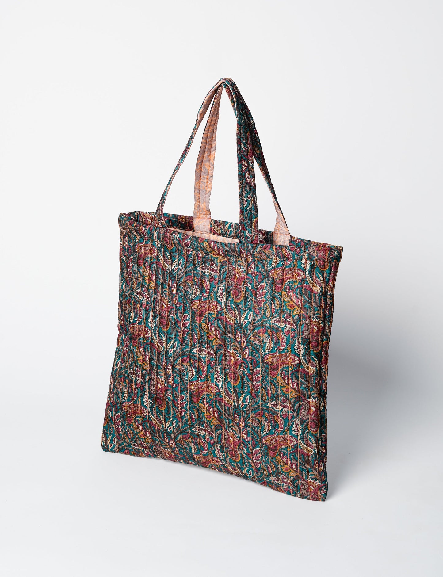 Elevate your style sustainably with our QUILTED SHOPPER BAG. Soft textures, vibrant colors, and a positive impact on people and the planet. Perfect for the office, shopping, or happy hour. Crafted from pre-loved saris for eco-conscious fashionistas!