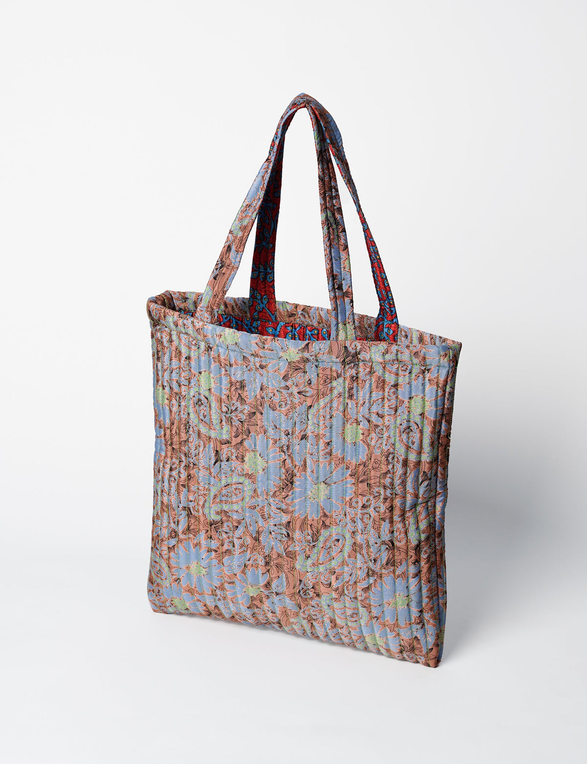 Elevate your style sustainably with our QUILTED SHOPPER BAG. Soft textures, vibrant colors, and a positive impact on people and the planet. Perfect for the office, shopping, or happy hour. Crafted from pre-loved saris for eco-conscious fashionistas!