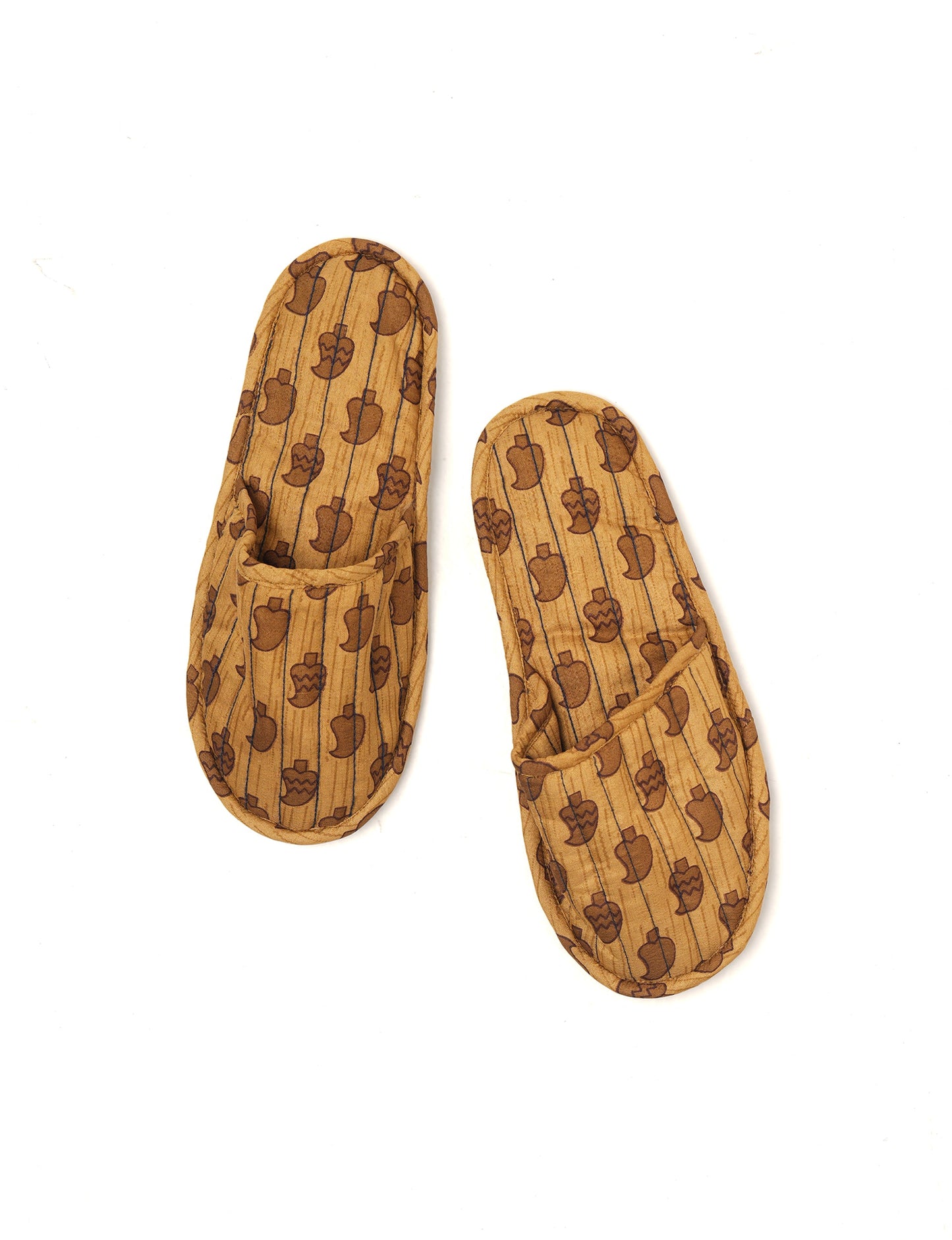 Elevate your downtime with our Quilted Slippers. Ethical, sustainable, and crafted by female artisans in Mumbai, these slippers offer cushioned comfort with a touch of chic style. Warm on the inside, fashionable on the outside, step into sustainable luxury.