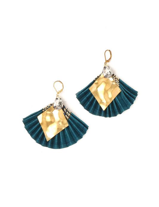 Elevate your style sustainably with our PLEATED EARRINGS – a fusion of ethical fashion and eco-conscious design. Created from pre-loved saris using heat set pleats, these earrings embody zero waste clothing and upcycled fashion. Fastened with hooks, adorned with a diamond-shaped metallic plate and a special drop-shaped jewel. Hypoallergy tested metal hooks, nickel, and lead-free, making them a conscious and skin-friendly accessory.