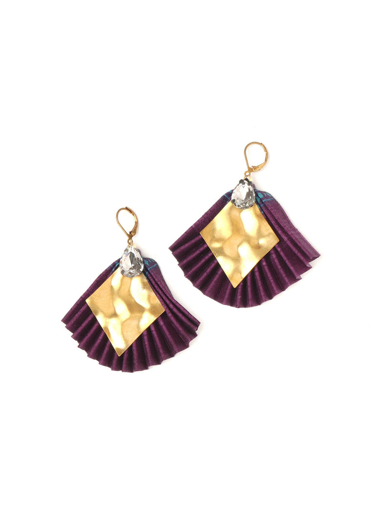 Purple pleated fabric earrings with hammered gold diamond shapes and clear teardrop crystals, gold lever-back hooks, flat lay