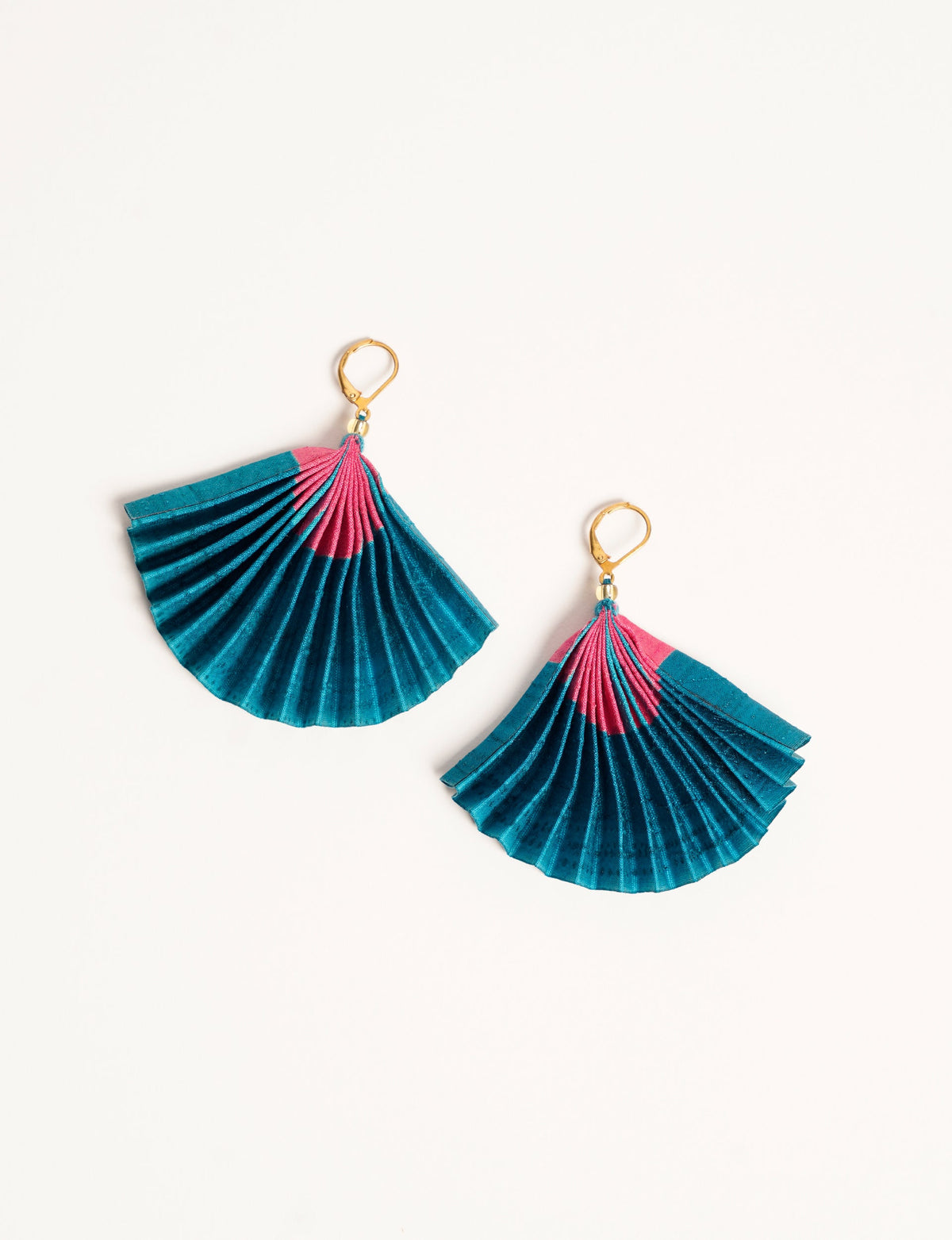 Elevate your style sustainably with our PLEATED EARRINGS – a timeless creation from pre-loved Indian saris, crafted using innovative heat setting techniques. Align with ethical clothing, green fashion, and slow fashion, these earrings are a statement of mindful elegance. Hypoallergy tested metal hooks make them a skin-friendly, sustainable choice.