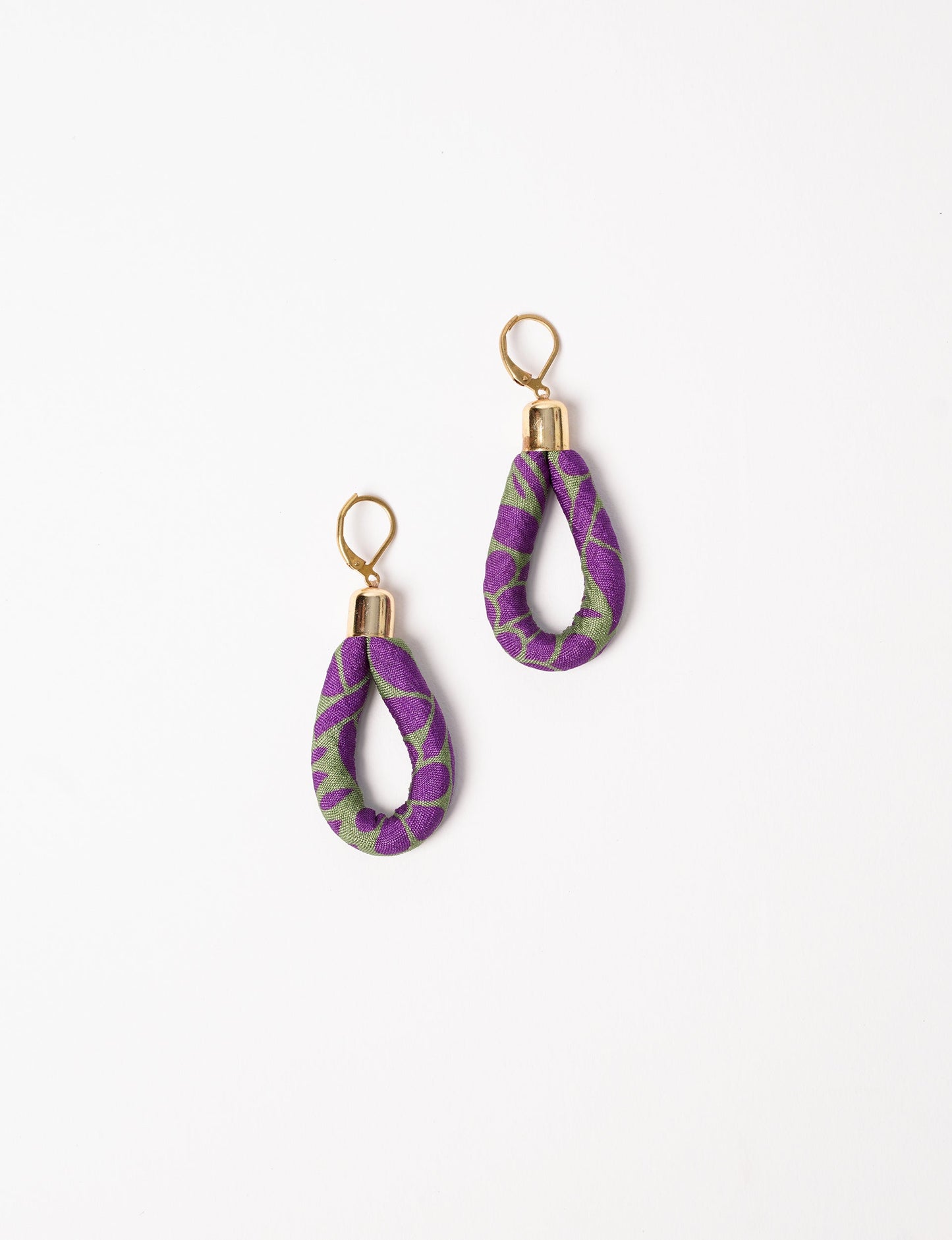 Elevate your style sustainably with our Rope Earrings. Crafted from cotton rope hand-wrapped with pre-loved saris, these earrings are a testament to ethical and green fashion. Make a conscious choice for a brighter, eco-friendly future.