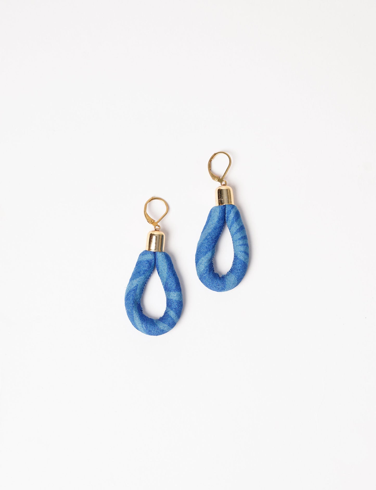 Elevate your style sustainably with our Rope Earrings. Crafted from cotton rope hand-wrapped with pre-loved saris, these earrings are a testament to ethical and green fashion. Make a conscious choice for a brighter, eco-friendly future.