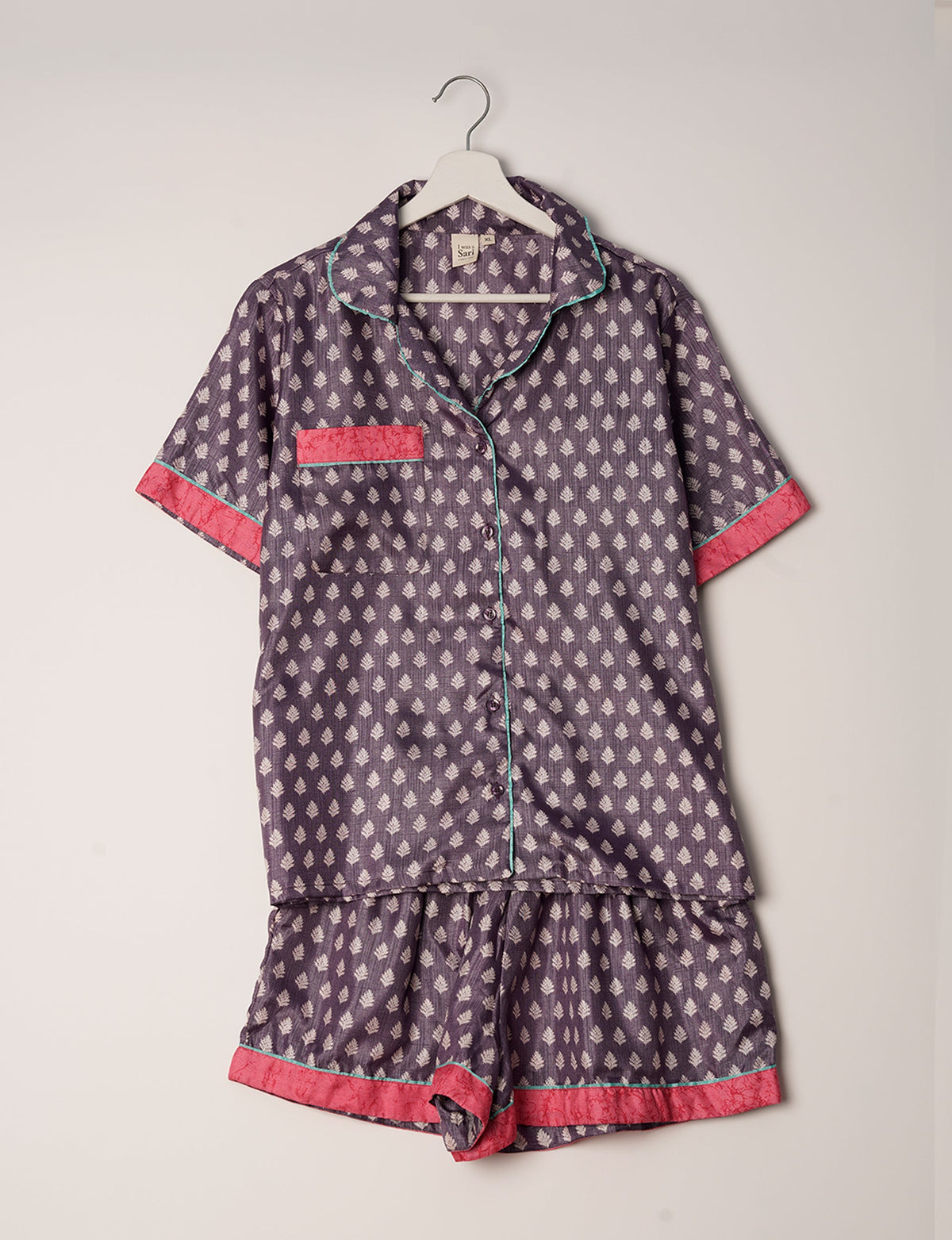 Indulge in comfort and style with our PJ Set Short, now with short sleeves. Crafted from upcycled saris, these shorts embody a zero-waste mentality for sustainable sleepwear. Versatile from day to night, perfect for beach lounging or poolside yoga, these pajamas redefine conscious fashion.