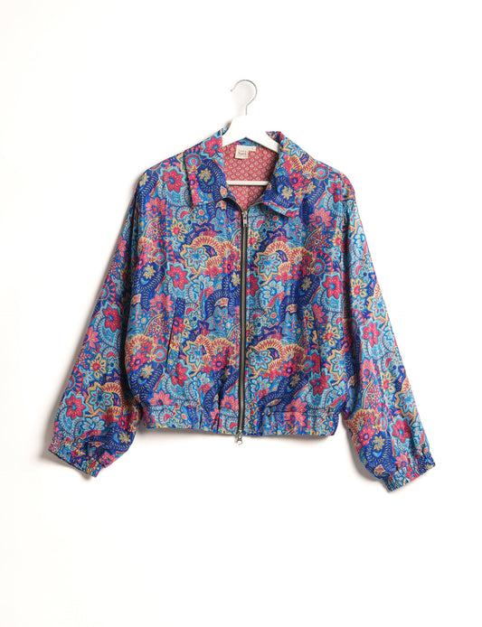 Stylish BOMBER JACKET, an upcycled clothing masterpiece with a cute cropped shape, elasticated details, and detachable metallic zipper. Contrast sari print lining adds a unique touch. Explore sustainable and eco-friendly fashion.