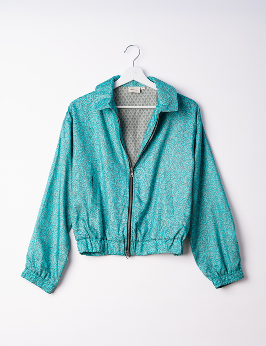 Stylish BOMBER JACKET, an upcycled clothing masterpiece with a cute cropped shape, elasticated details, and detachable metallic zipper. Contrast sari print lining adds a unique touch. Explore sustainable and eco-friendly fashion.