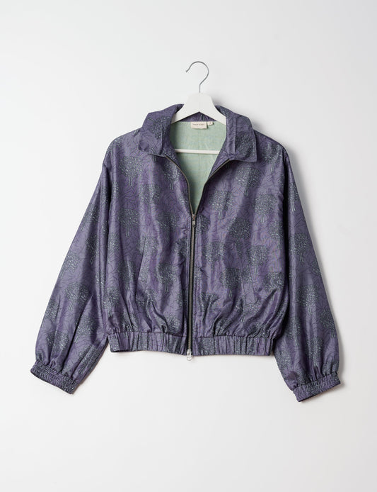 Stylish BOMBER JACKET, an upcycled clothing masterpiece with a cute cropped shape, elasticated details, and detachable metallic zipper. Contrast sari print lining adds a unique touch. Explore sustainable and eco-friendly fashion.