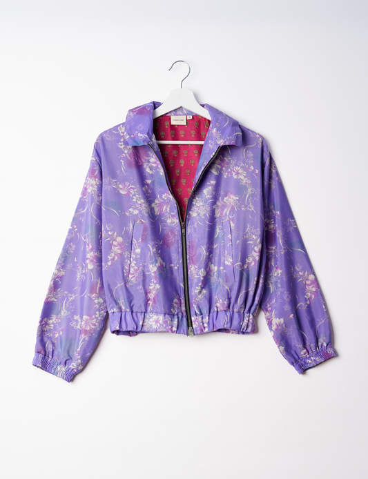 Stylish BOMBER JACKET, an upcycled clothing masterpiece with a cute cropped shape, elasticated details, and detachable metallic zipper. Contrast sari print lining adds a unique touch. Explore sustainable and eco-friendly fashion.