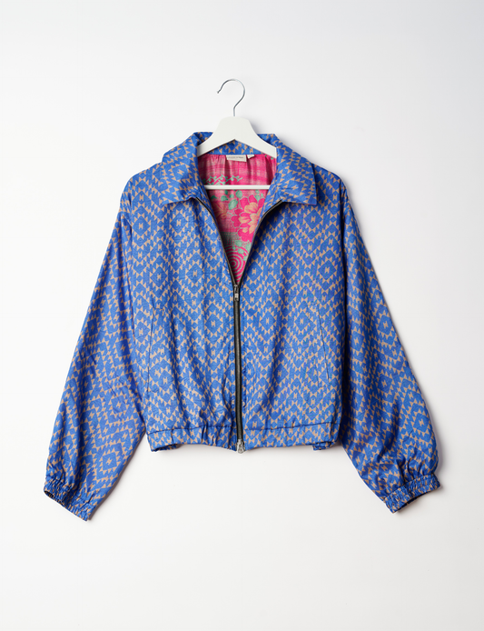 Stylish BOMBER JACKET, an upcycled clothing masterpiece with a cute cropped shape, elasticated details, and detachable metallic zipper. Contrast sari print lining adds a unique touch. Explore sustainable and eco-friendly fashion.