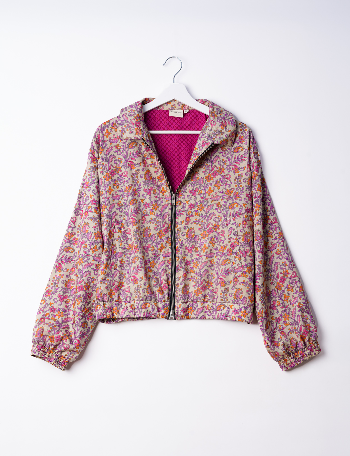 Stylish BOMBER JACKET, an upcycled clothing masterpiece with a cute cropped shape, elasticated details, and detachable metallic zipper. Contrast sari print lining adds a unique touch. Explore sustainable and eco-friendly fashion.