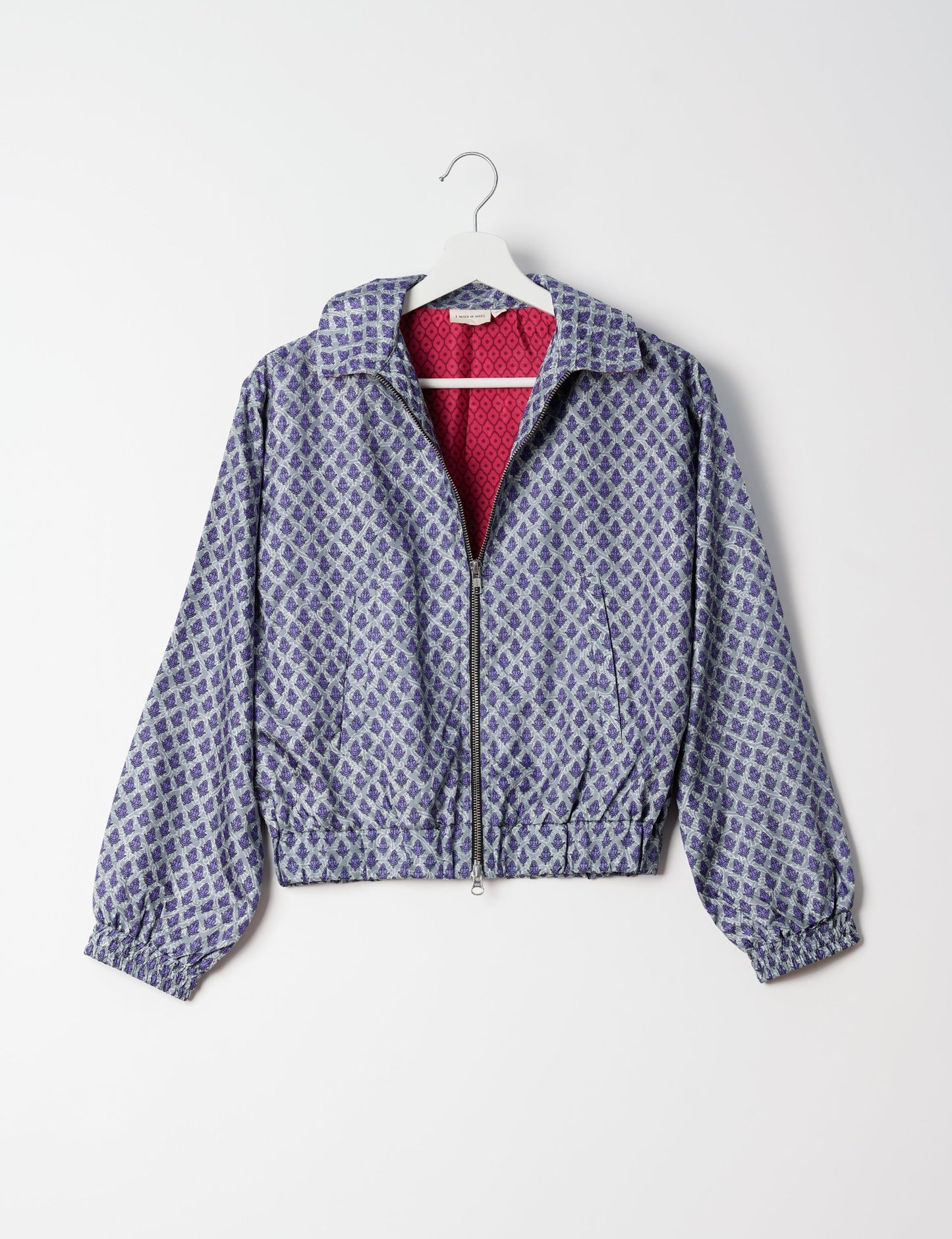 Stylish BOMBER JACKET, an upcycled clothing masterpiece with a cute cropped shape, elasticated details, and detachable metallic zipper. Contrast sari print lining adds a unique touch. Explore sustainable and eco-friendly fashion.