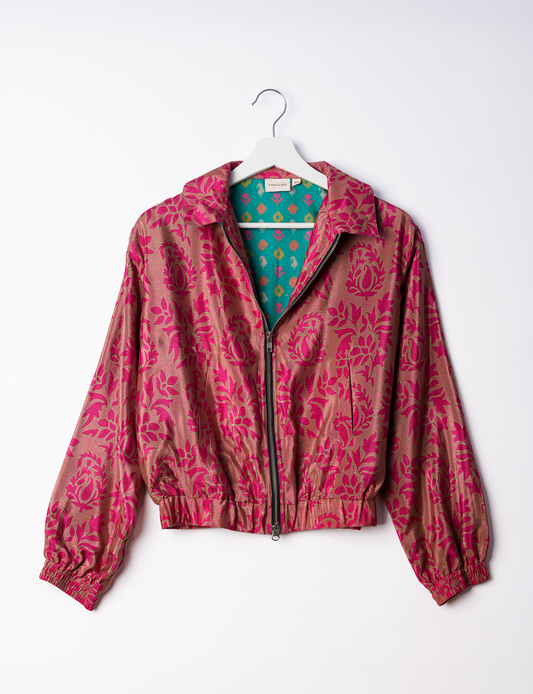 Stylish BOMBER JACKET, an upcycled clothing masterpiece with a cute cropped shape, elasticated details, and detachable metallic zipper. Contrast sari print lining adds a unique touch. Explore sustainable and eco-friendly fashion.