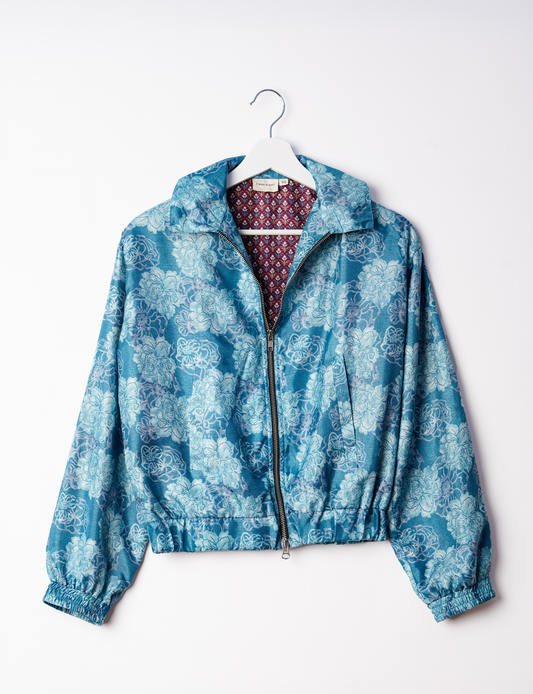 Stylish BOMBER JACKET, an upcycled clothing masterpiece with a cute cropped shape, elasticated details, and detachable metallic zipper. Contrast sari print lining adds a unique touch. Explore sustainable and eco-friendly fashion.