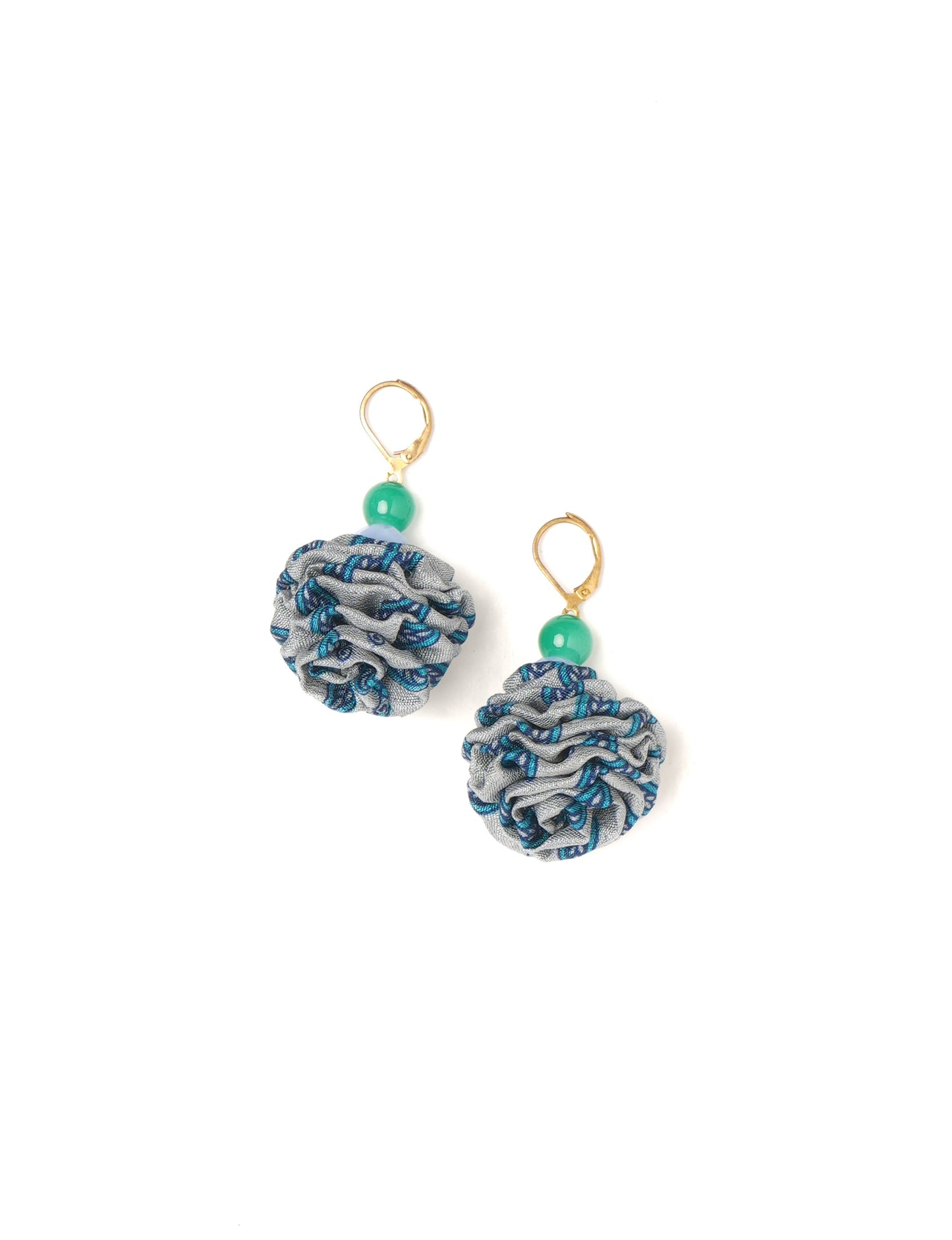 Elevate your style with our Ruffle Earrings, adorned with unique ruffle ball florets crafted from upcycled Indian saris using the traditional Aari embroidery technique. These sustainable earrings feature two glass beads and nickel-free, hypoallergenic metal hooks. Embrace ethical and green fashion with these statement pieces.