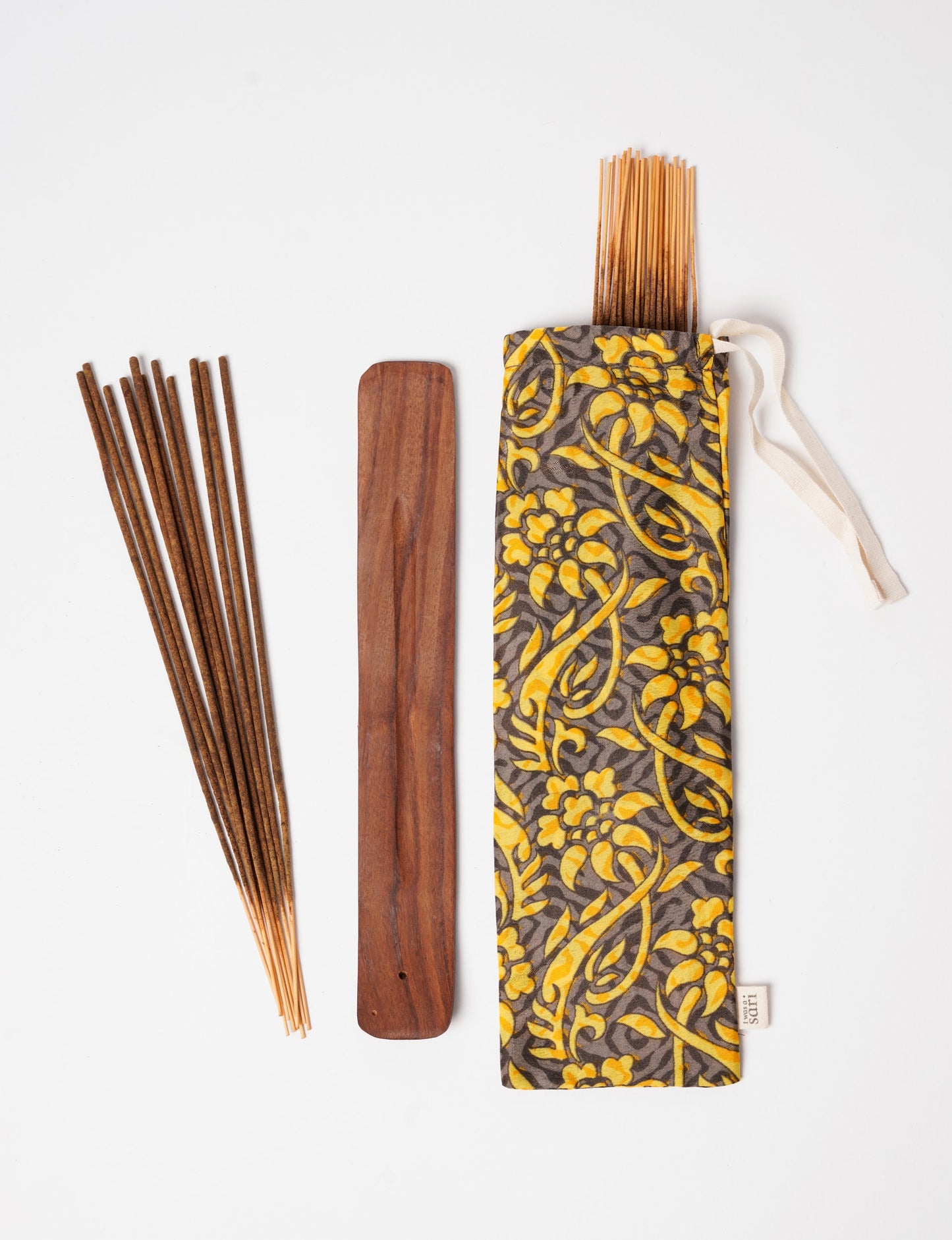 Discover serenity with our Incense Stick Set, presented in a beautifully crafted sari pouch. Made from fragrant flowers, these incense sticks embody eco-friendly products and sustainable living, perfect for conscious consumers seeking ethical clothing and green fashion alternatives.