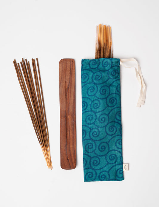 Discover serenity with our Incense Stick Set, presented in a beautifully crafted sari pouch. Made from fragrant flowers, these incense sticks embody eco-friendly products and sustainable living, perfect for conscious consumers seeking ethical clothing and green fashion alternatives.