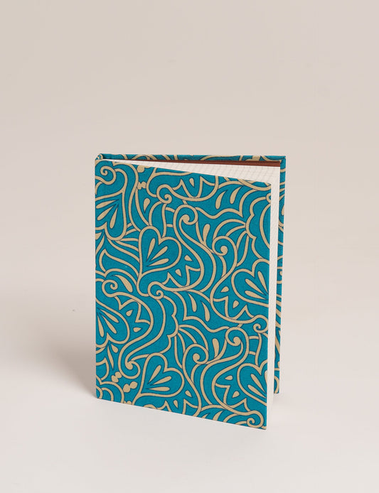 Elevate your scribbling experience with our A5 hardcover notebook, an epitome of green fashion. Sustainable and upcycled, this notebook features recycled fabric covers and aligns with the ethos of circular fashion. Dive into conscious living with our eco-friendly, recycled material notebook.