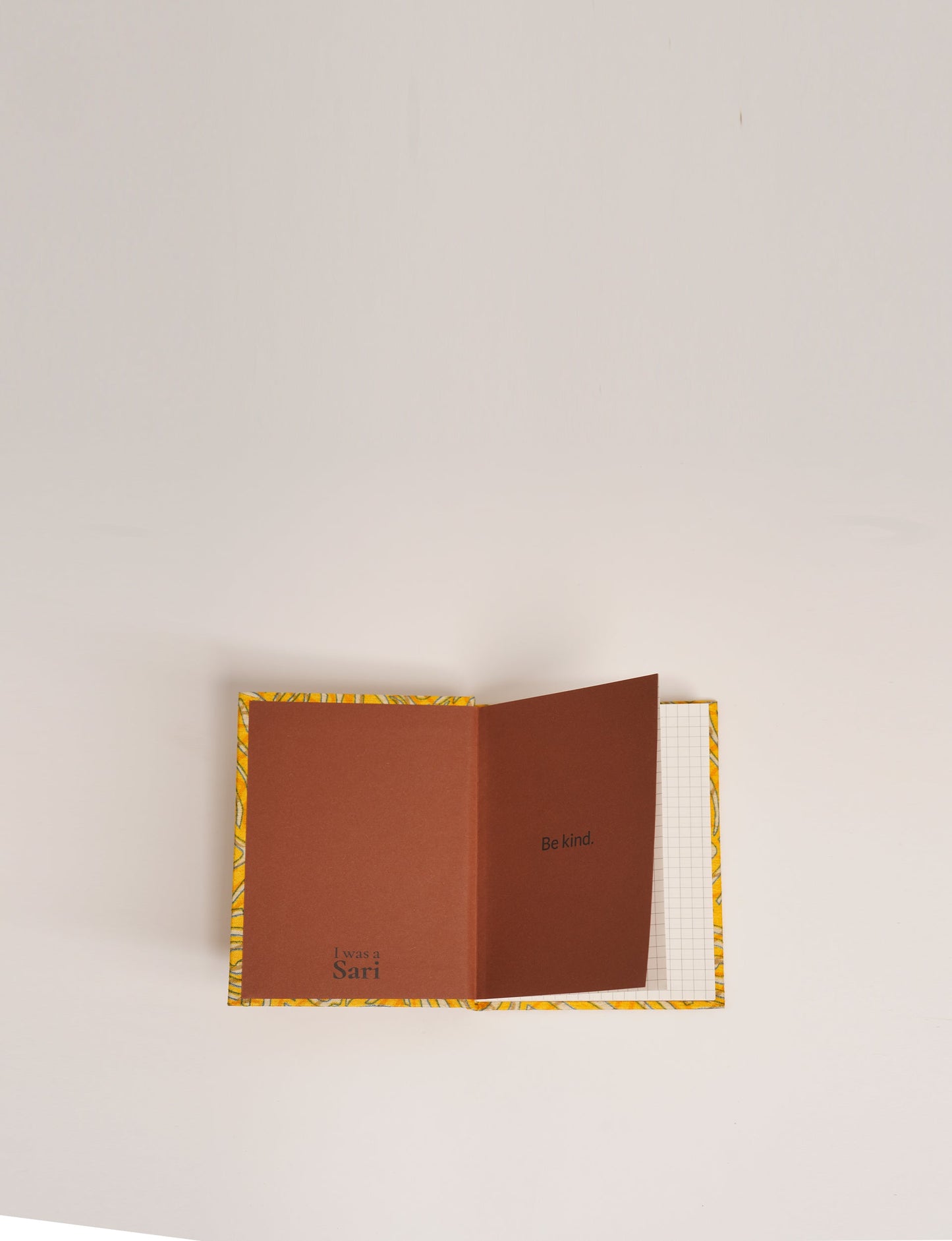 Indulge your creative spirit with our A6 hardcover notebook – a blend of sustainability and style. Made with 100% recycled paper and adorned with pre-loved sari fabric, this eco-conscious notebook encourages mindful note-taking and resonates with the principles of eco-friendly fashion.