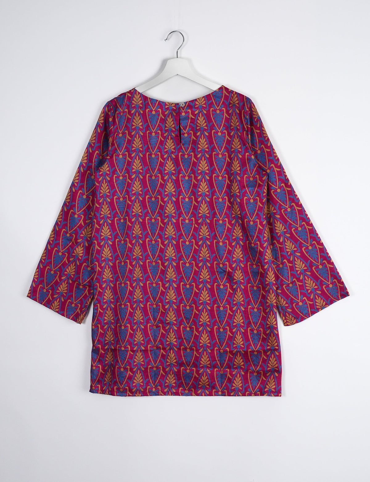 Chic and conscious, our A-line mini swing dress is a must-have in sustainable fashion. Adorned with flared sleeves, a keyhole back opening, and a mother of pearl button with twill tape loop. This zero waste, upcycled garment reflects the essence of eco-friendly and ethical clothing.