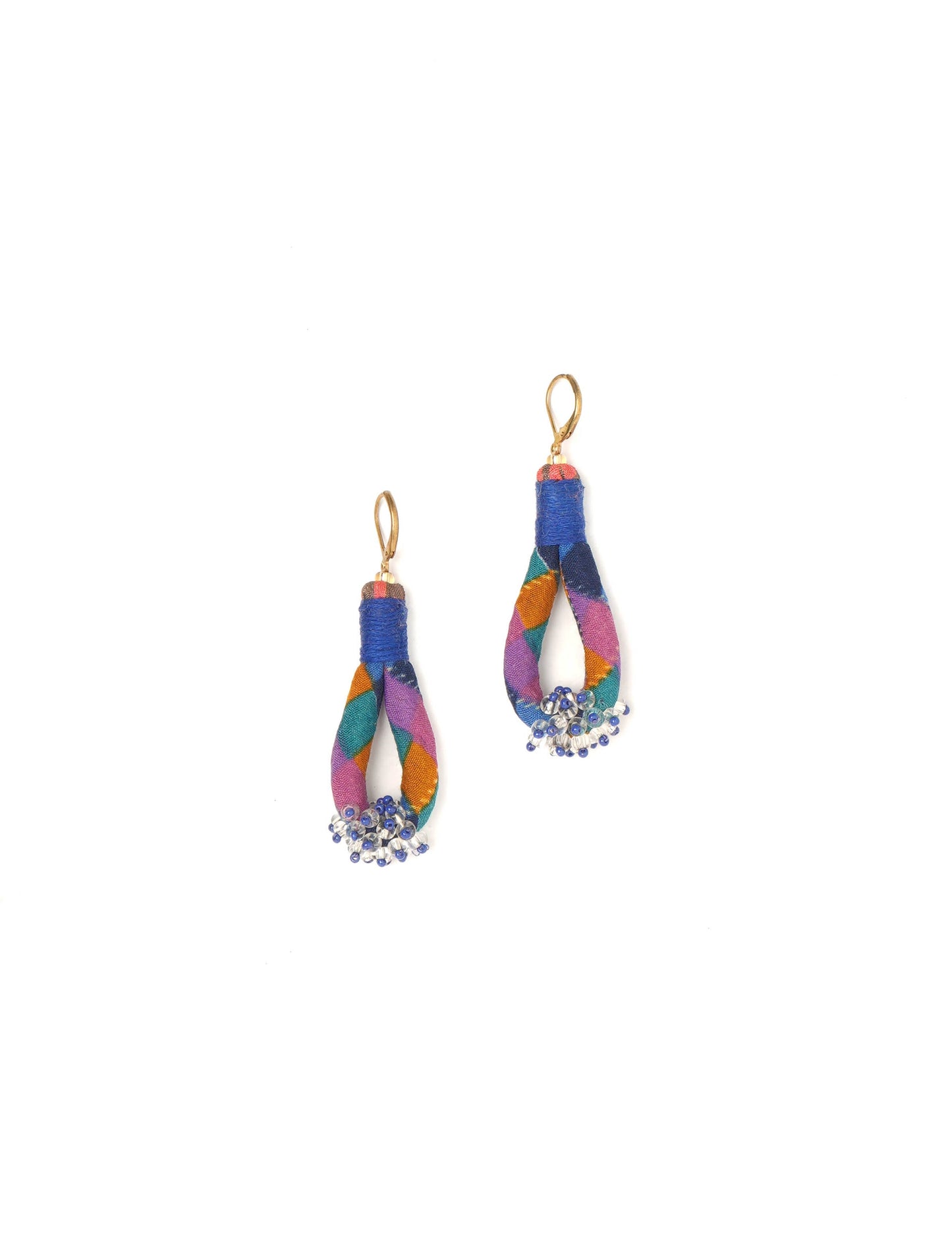 Discover the charm of Beaded Drop Earrings, meticulously crafted by Indian artisans. Recycled cotton rope, sari fabric, and surplus glass beads create an eco-friendly masterpiece. Hypoallergenic metal hooks ensure both style and comfort.