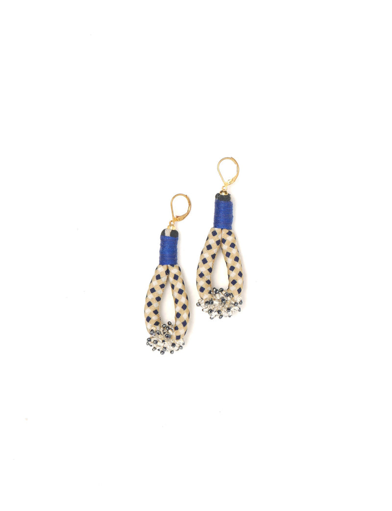 Beaded drop earrings with beige and navy check fabric loops, blue thread wrap, clear and black beads, and gold lever-back hooks
